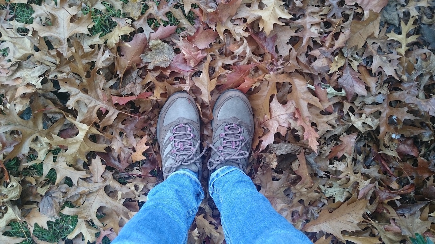 Wearing walking shoes in a big pile of leaves 