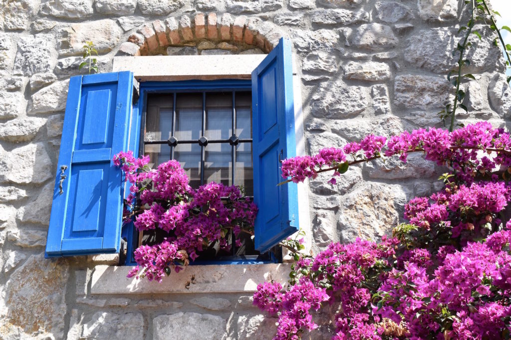 A white house with blue windows in Bodrum