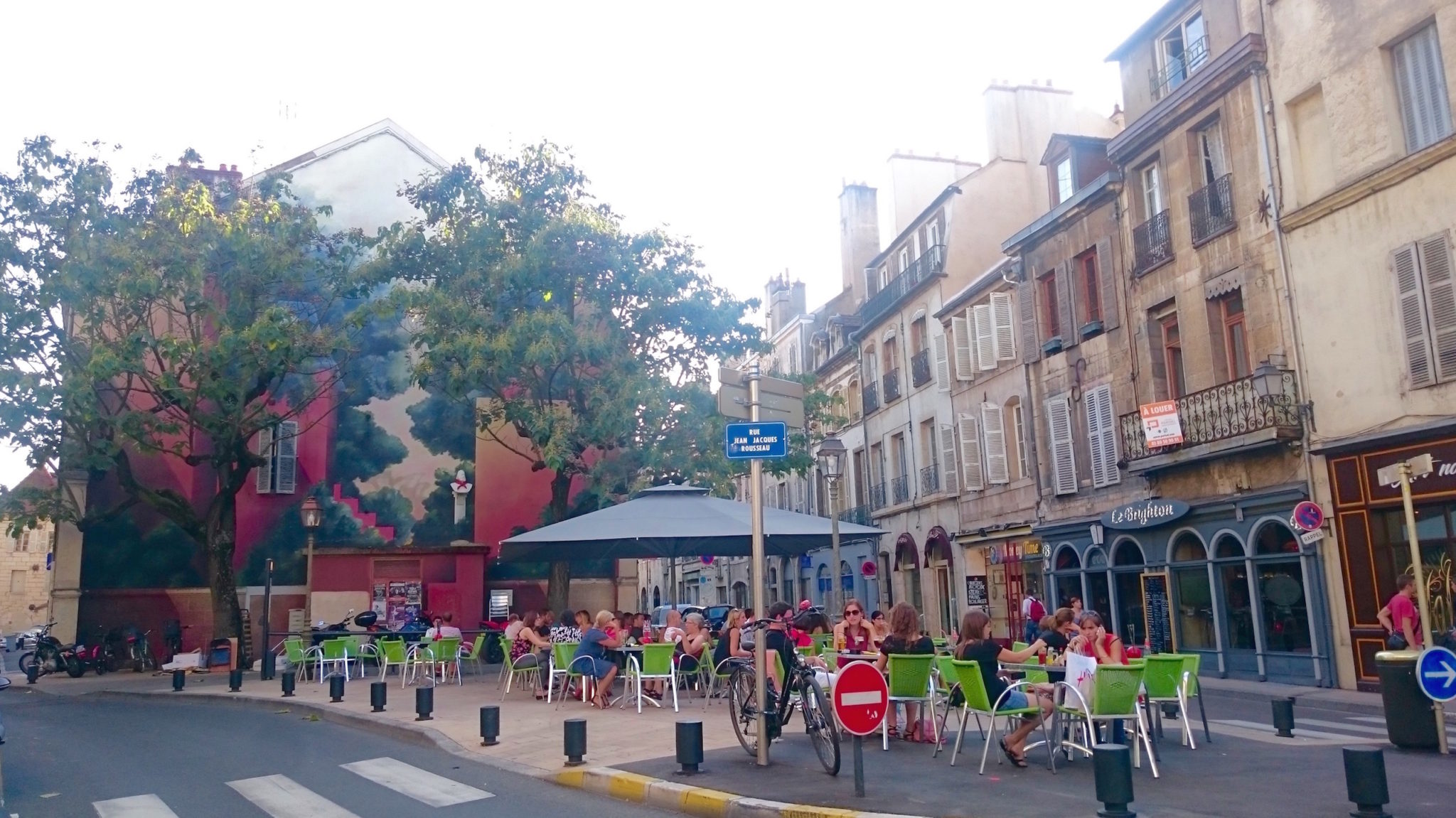 Friends and families enjoying an al fresco lunch in Dijon