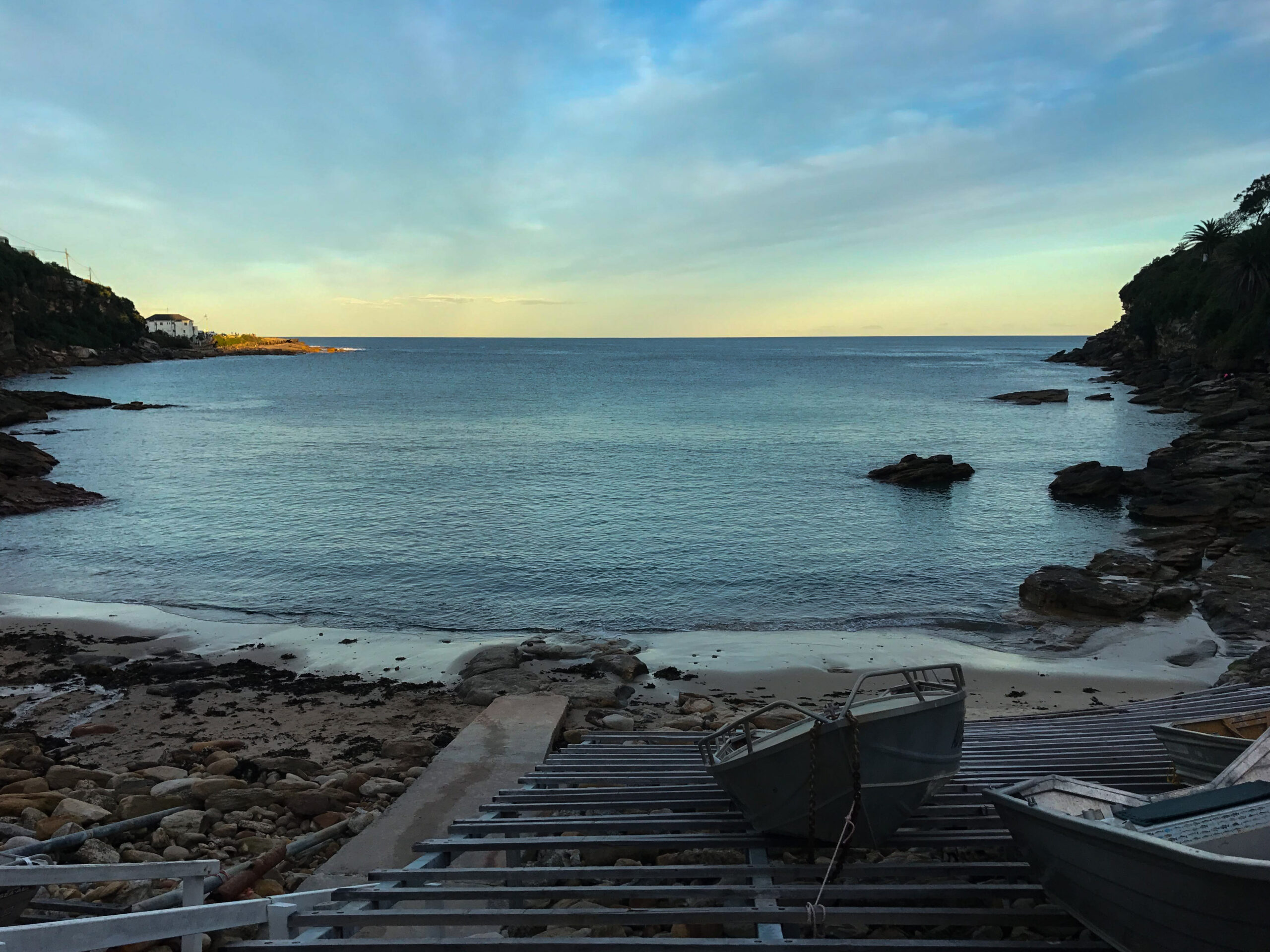 A boat ramp leads down to the water in Gordons Bay
