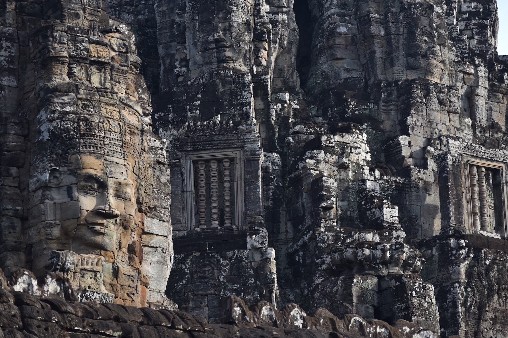 One of the many face carvings at the Bayon temple 