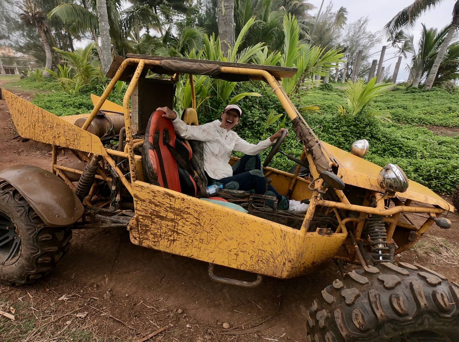 Hayley inside a big yellow buggy in the mud