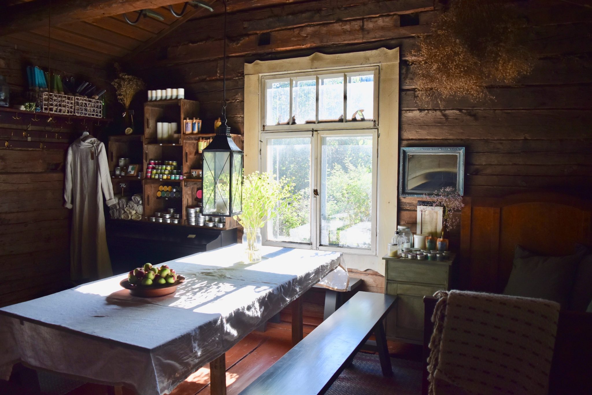 A traditional Finnish wooden cabin, with natural products on the shelves, home to Kaurilan Sauna