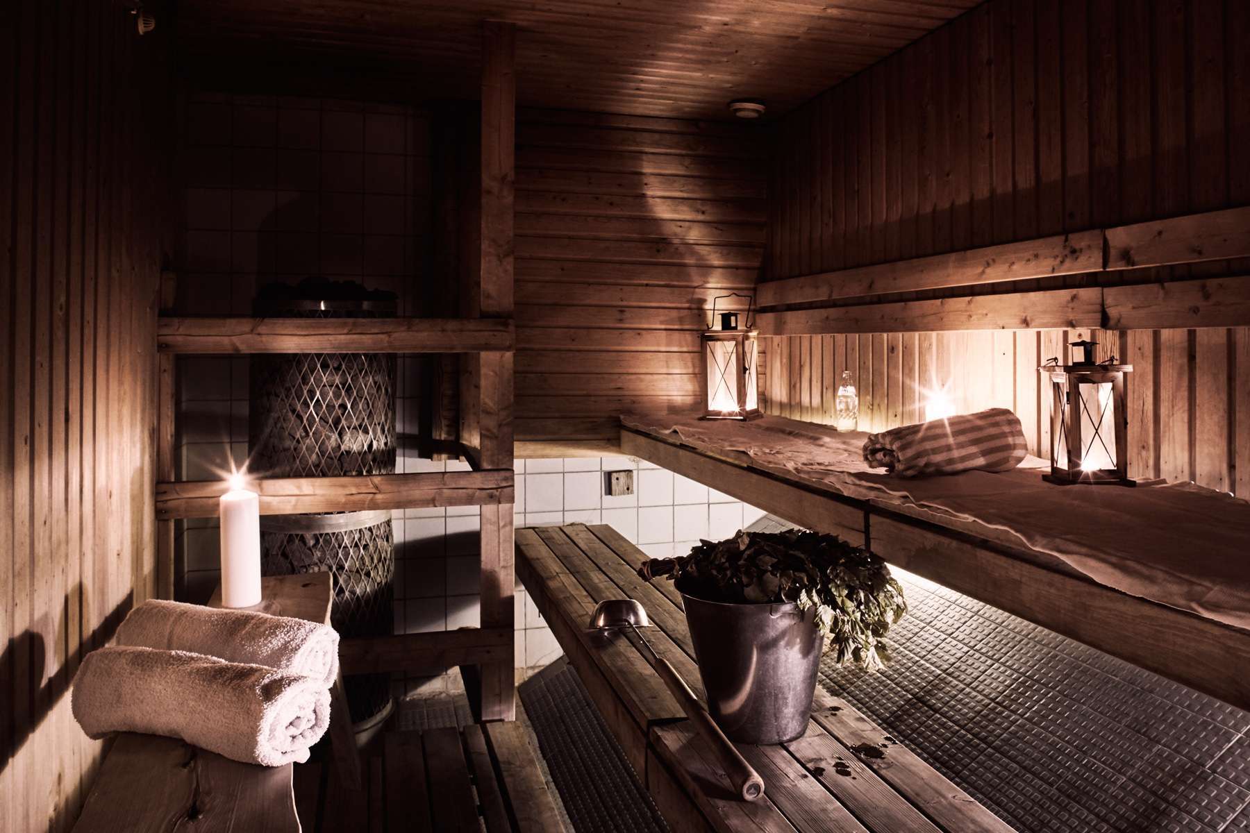 A traditional wooden Finnish sauna with candles