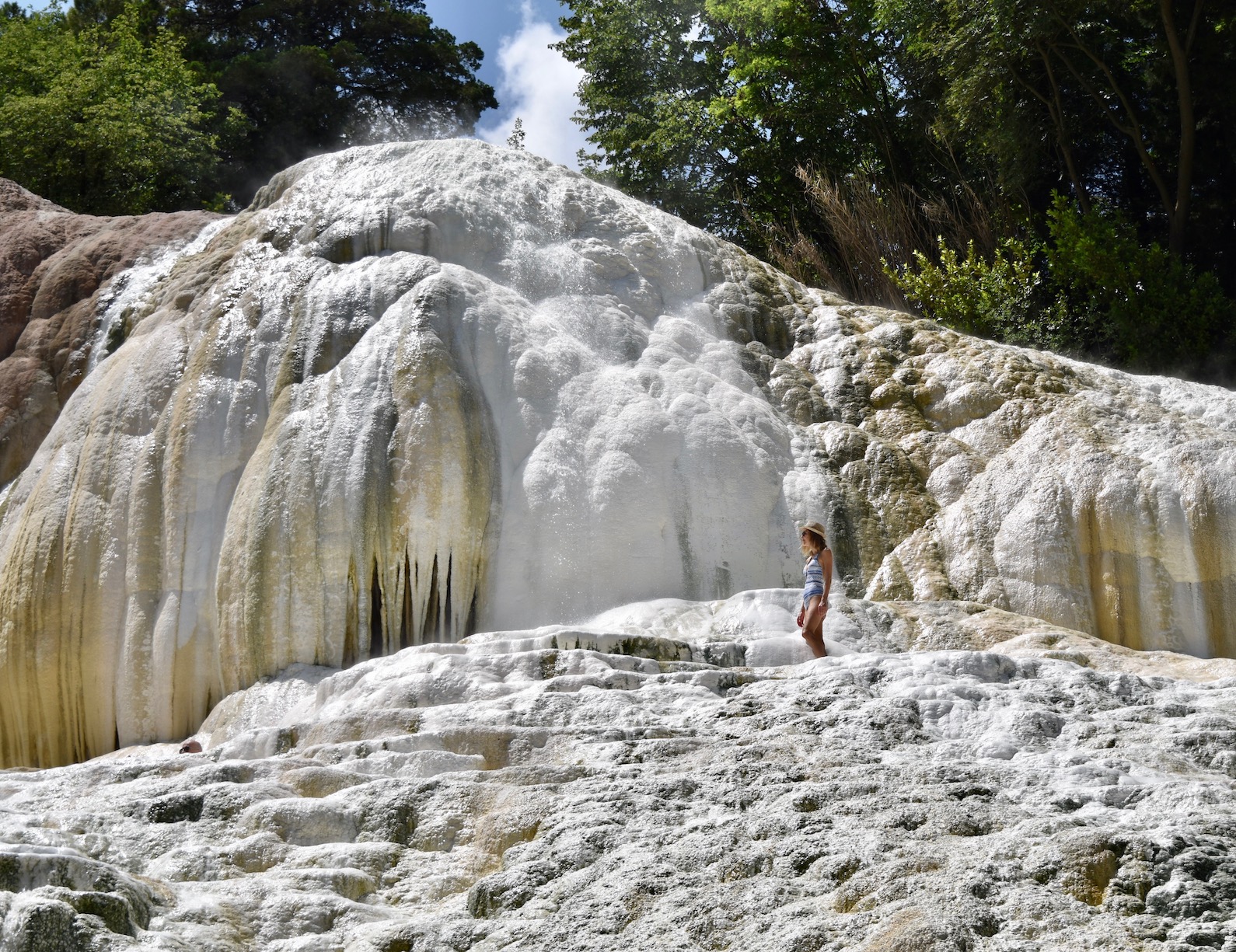 Hayley stands on the white rocks of the thermal springs at Bagni San Filippo in Tuscany