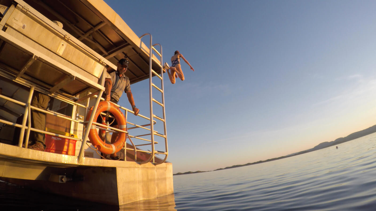 Hayley jumping off the boat into the lake 