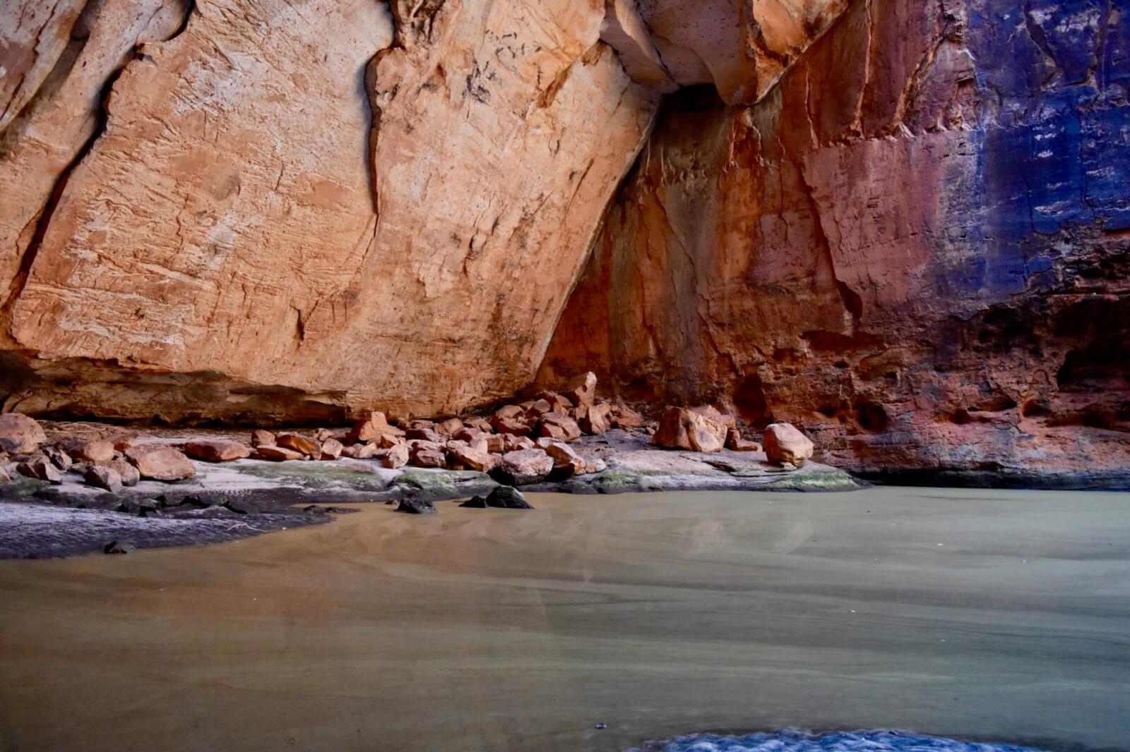 A large gorge with high walls and water below 