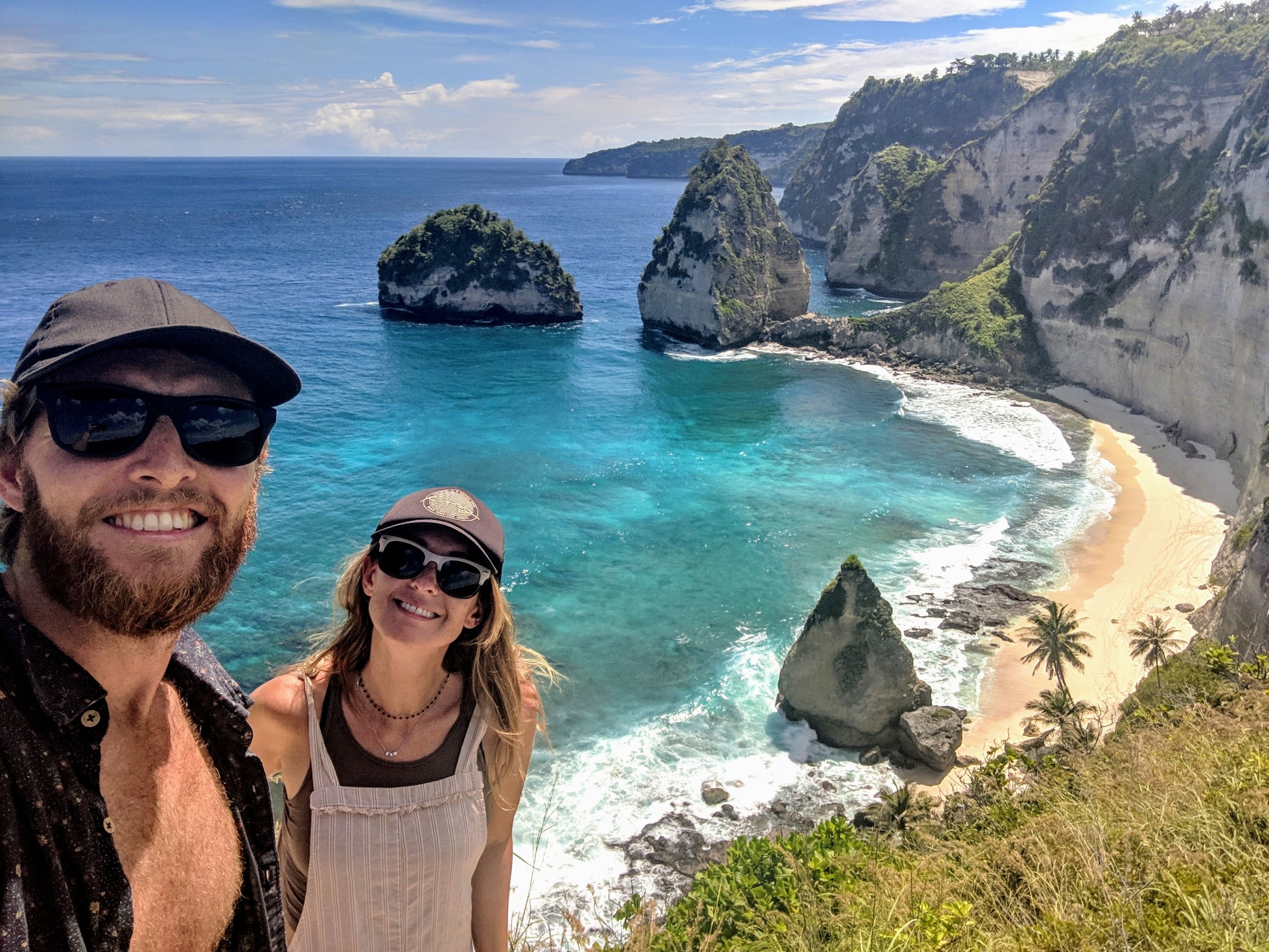 Sarah and James with a beautiful coastal view in the background