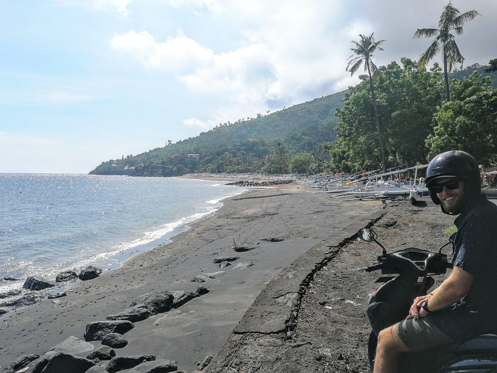 James on a scooter on a coastal road