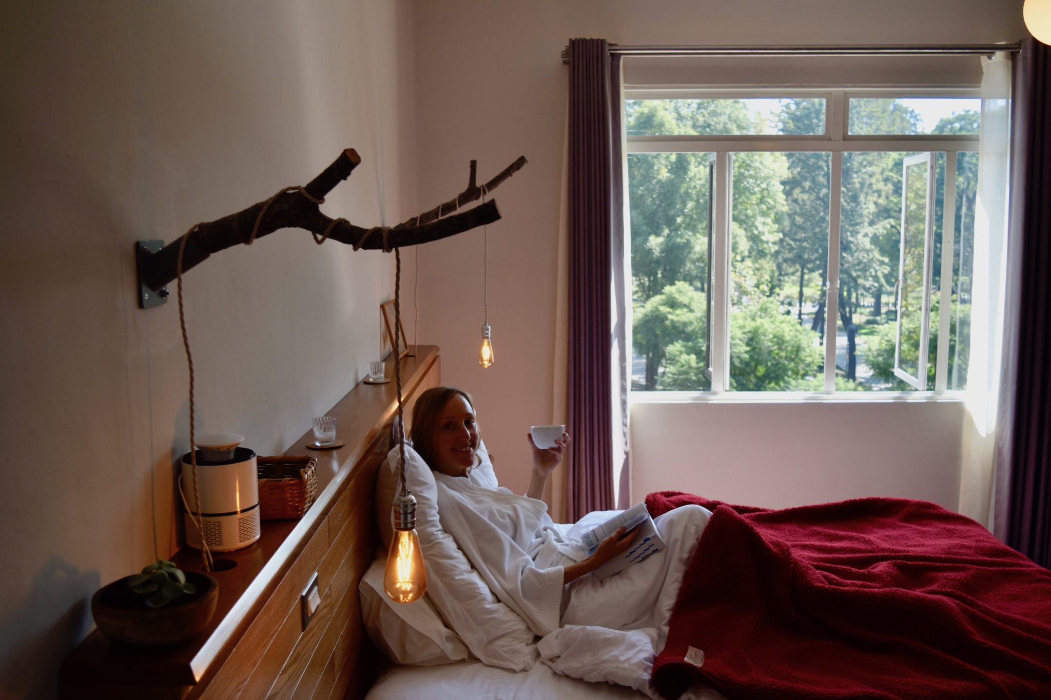 Hayley enjoying a coffee in bed at Chaya B&B Boutique