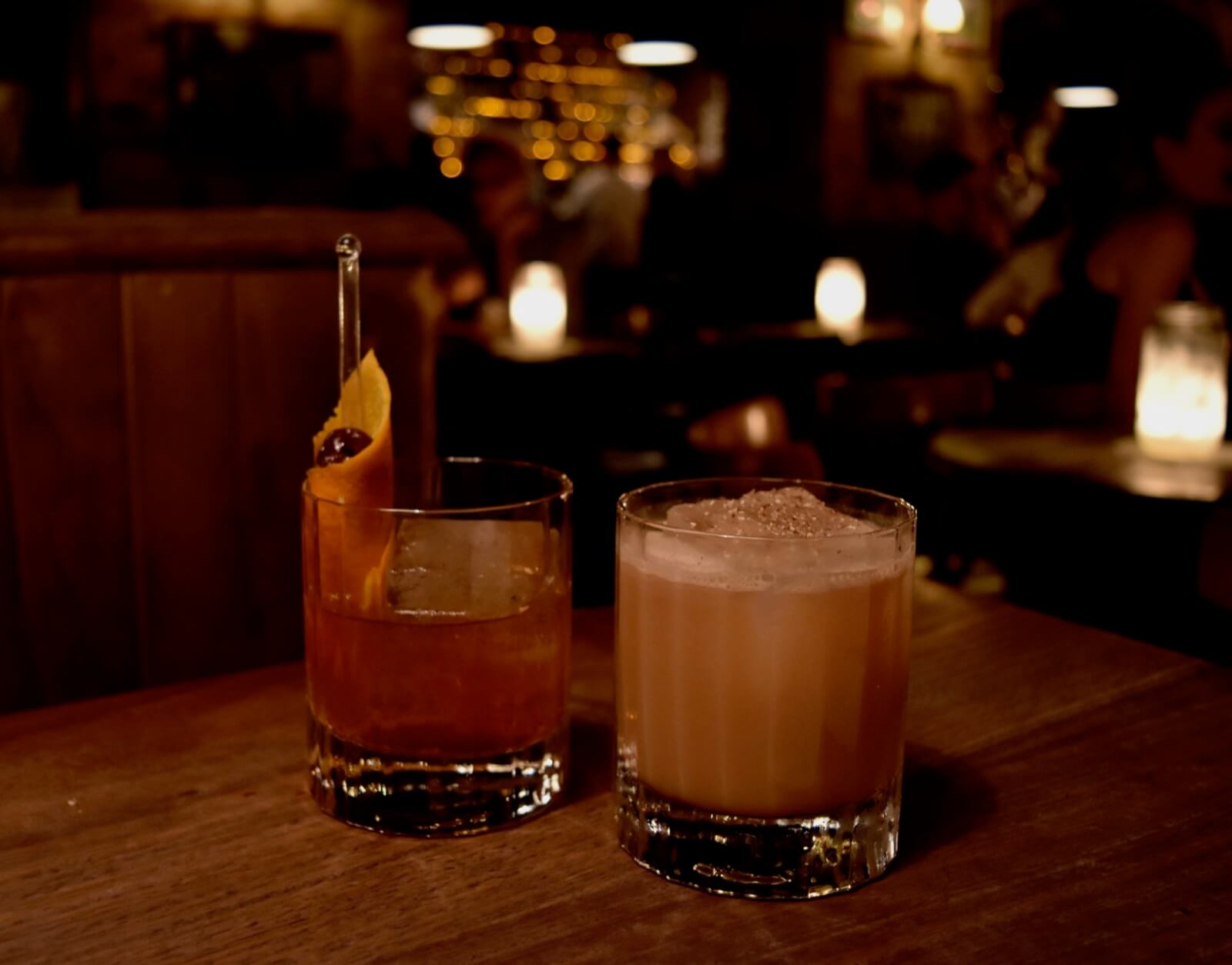 Two whisky cocktails on a table in one of Sydney's speakeasy bars