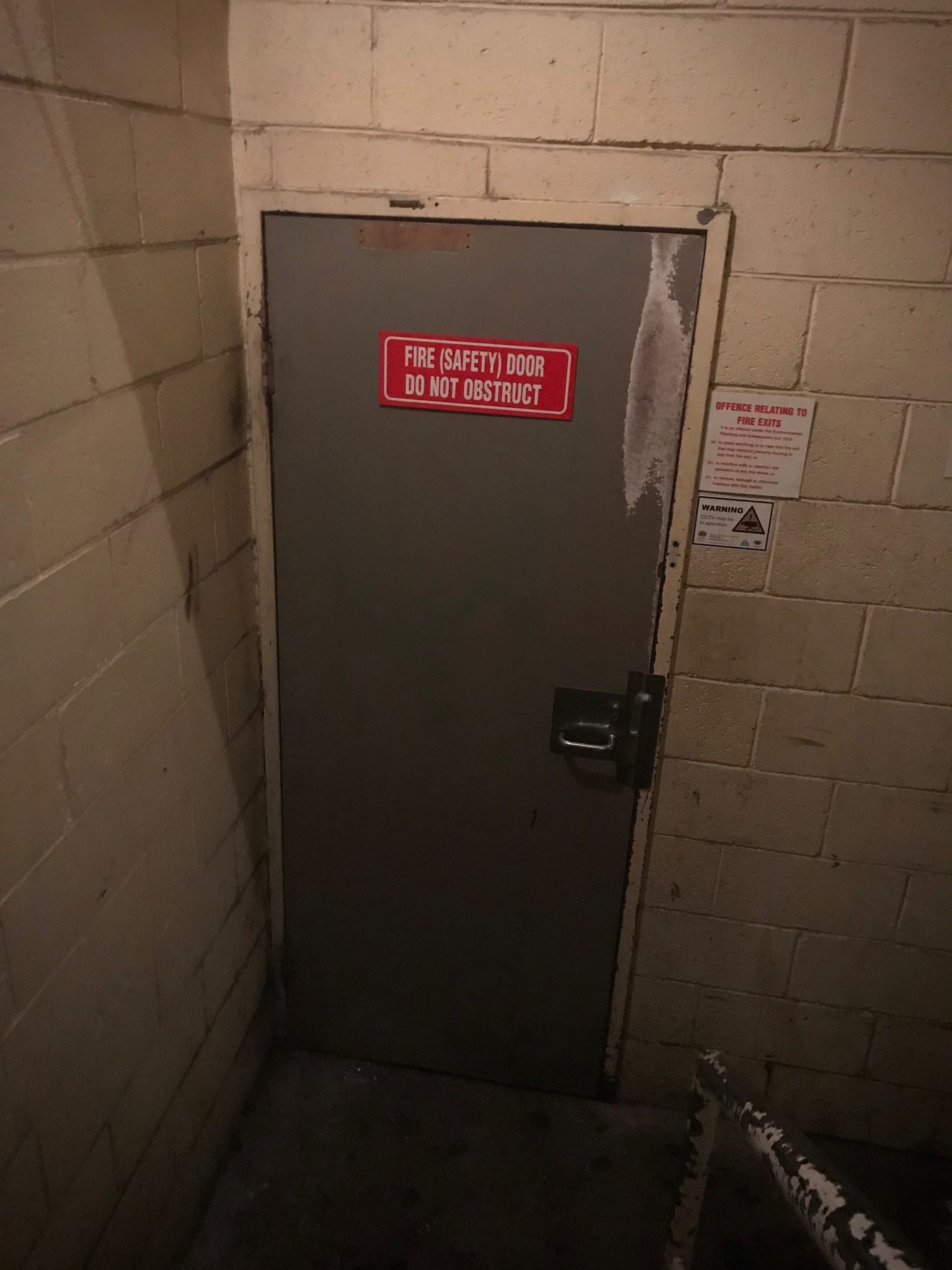 A fire safety door - the entrance to Baxter Inn