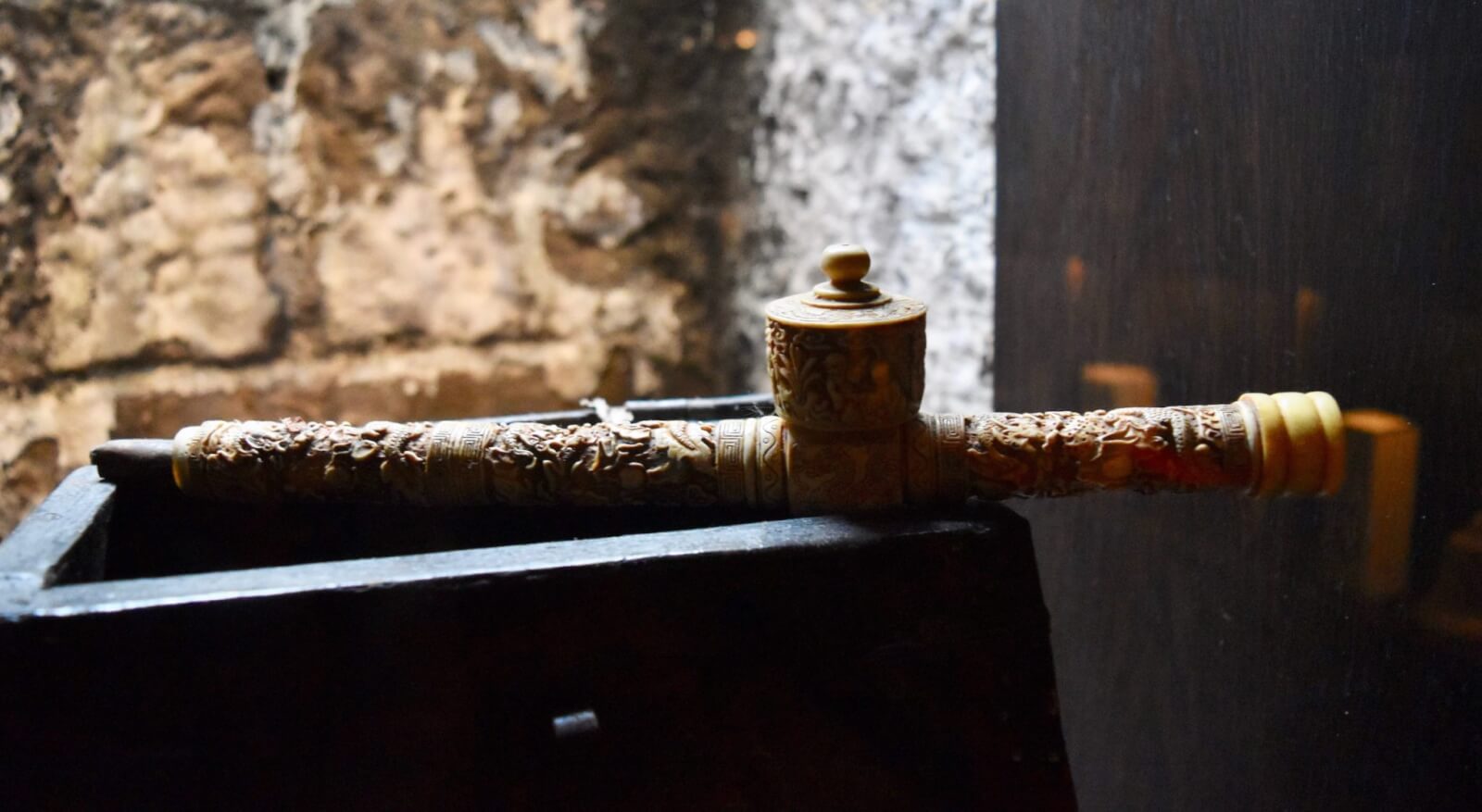 An ornate opium pipe