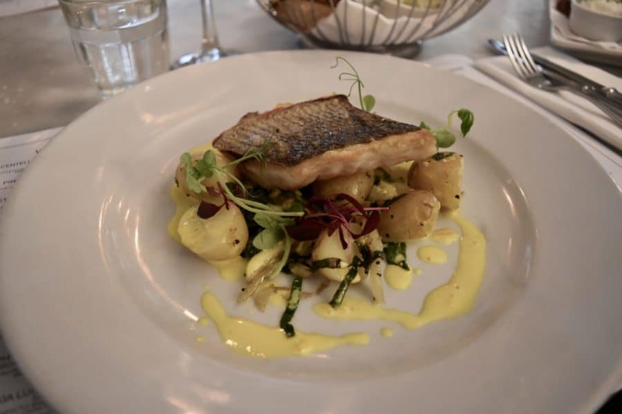 Sea bass cooked with swiss chard and boiled potatoes at Riddle and Finns 