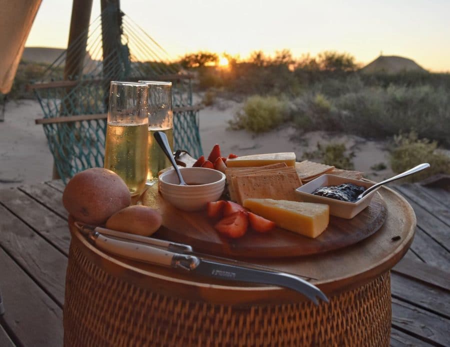 a delicious spread of cheese, fruit and wine in the dunes Sal Salis