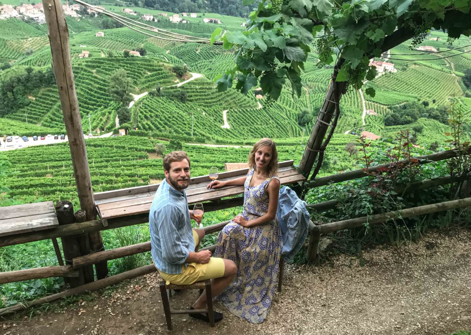 Hayley and Enrico drinking prosecco overlooking the hills in Valdobbiadene