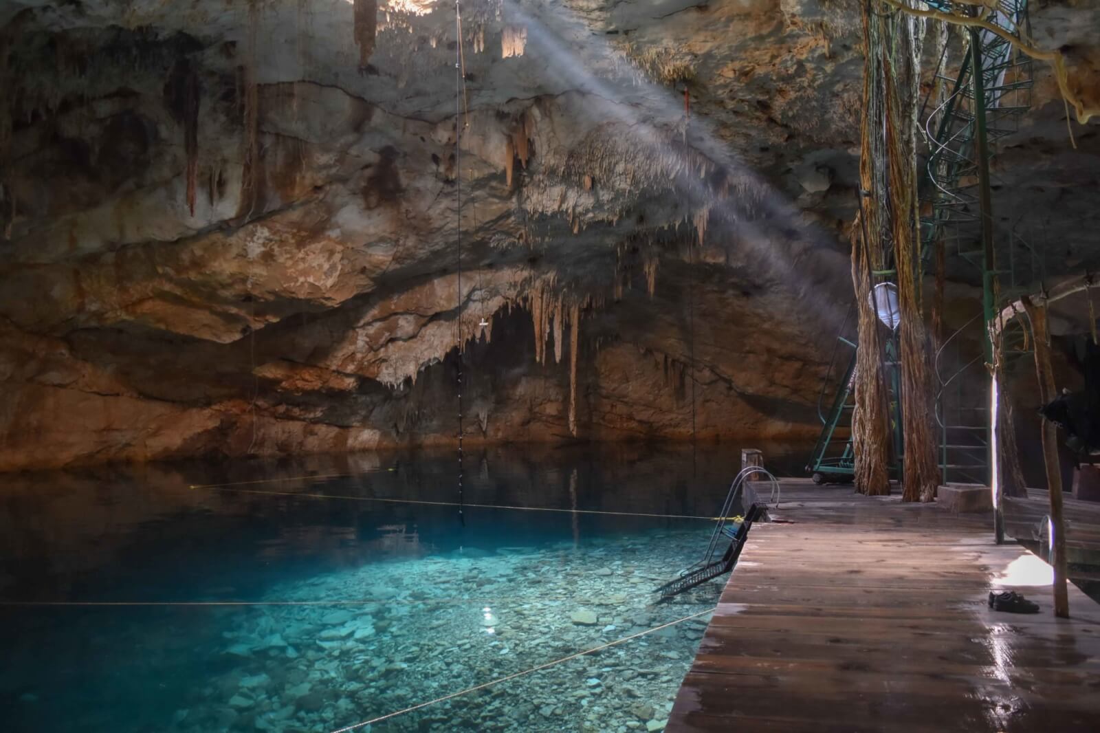 Still blue water inside cenote Canunchen