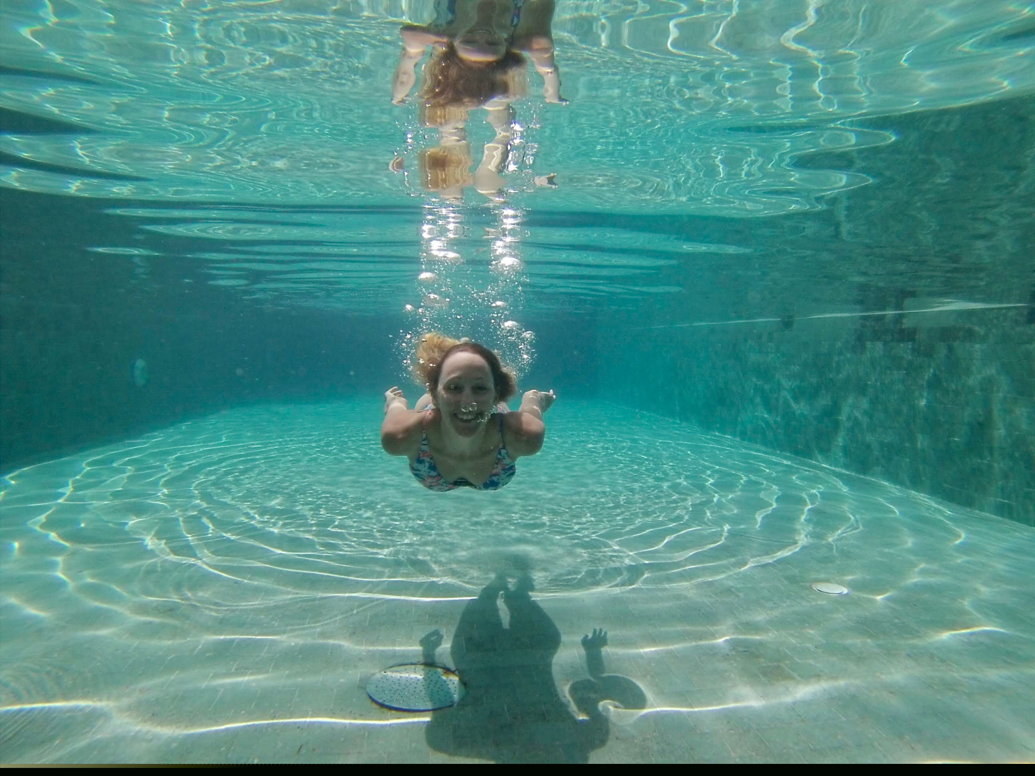 Hayley swimming in the pool in Cambodia