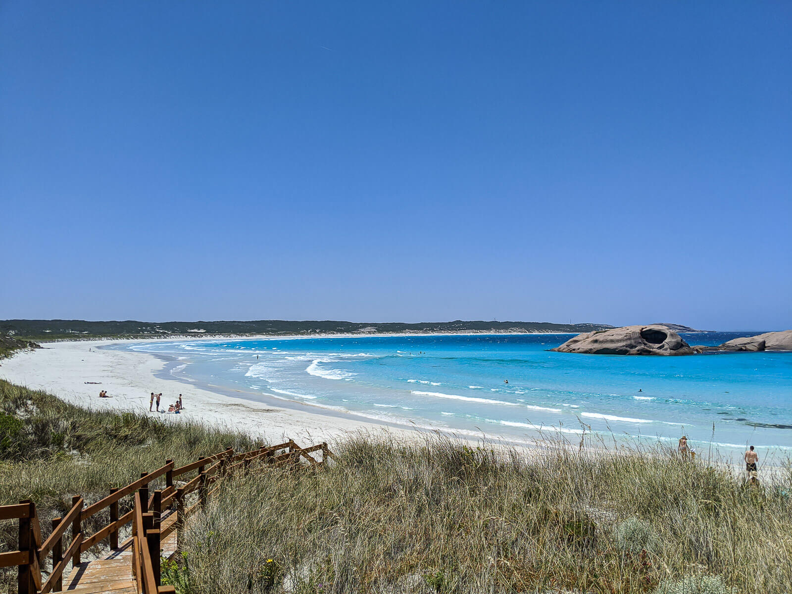 A white sand beach lapped turquoise waves 