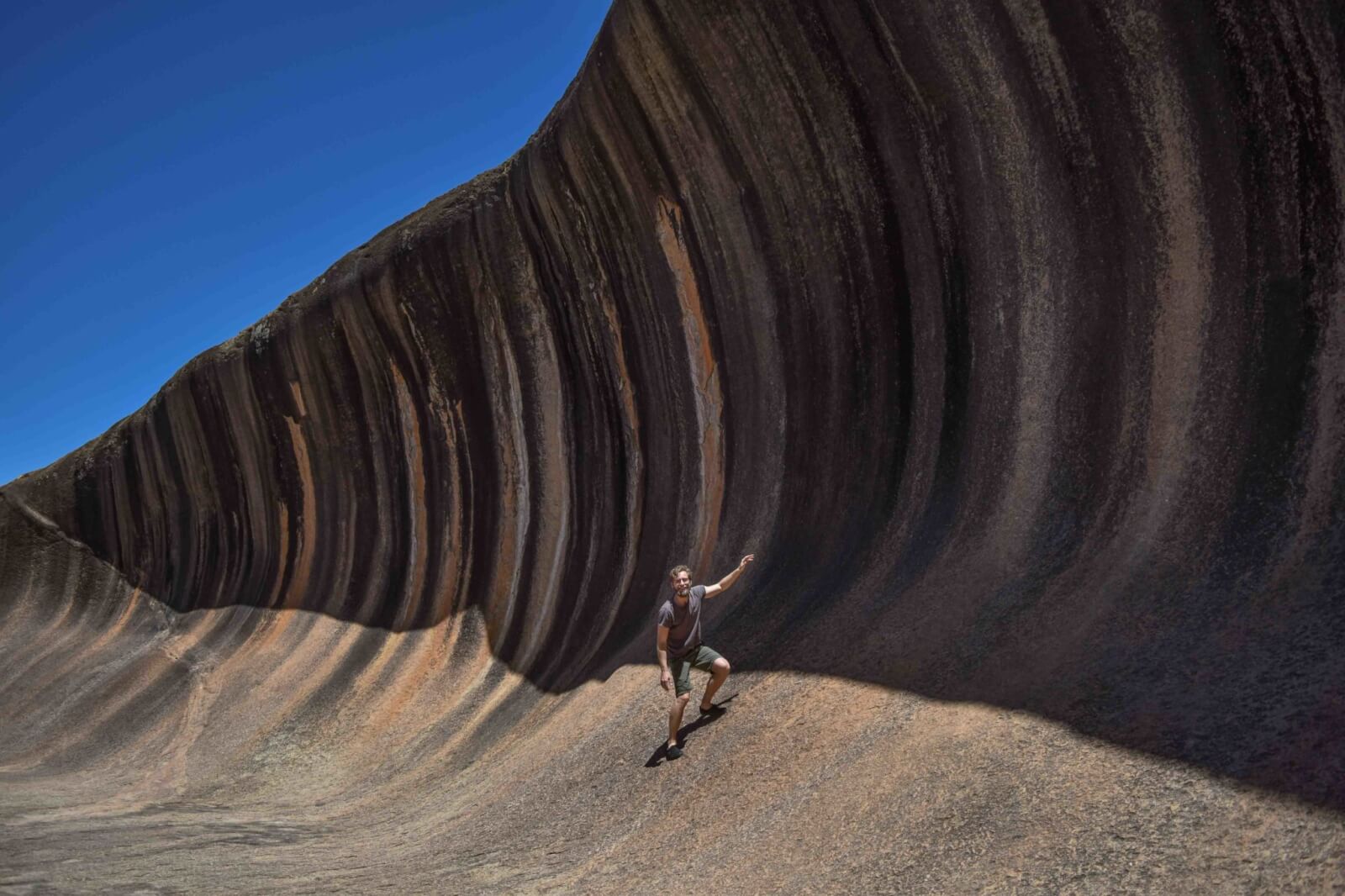 Enrico pretending to surf Wave Rock