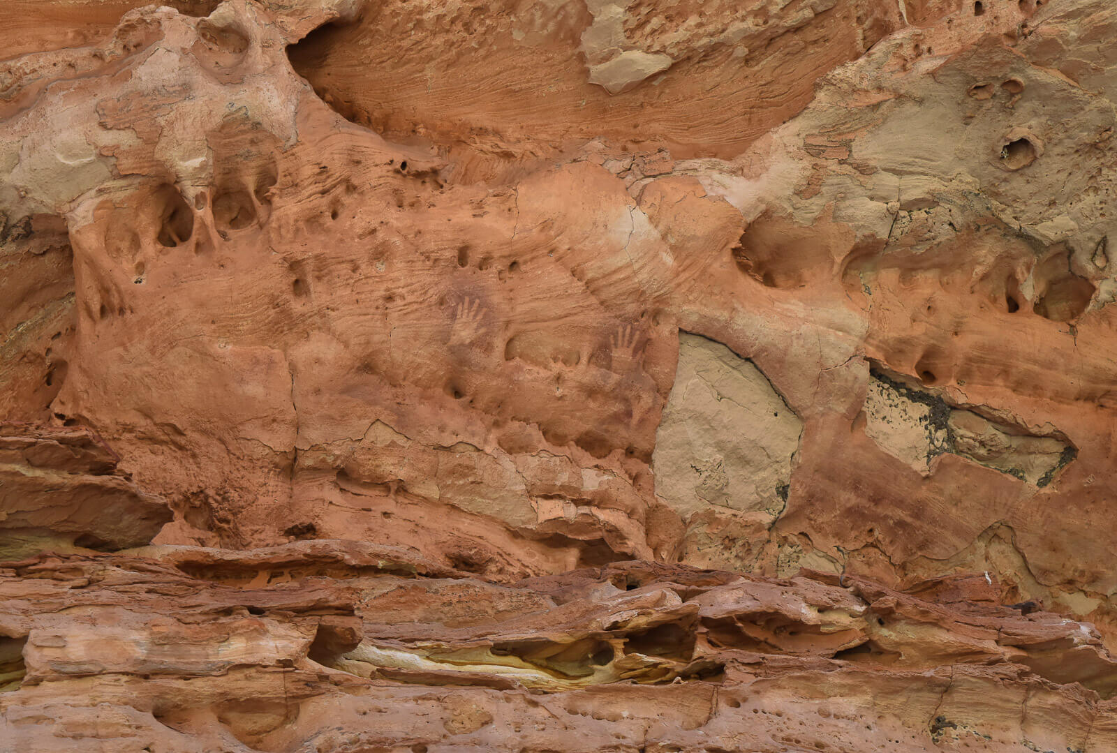 Aboriginal art in WA - hand prints on a rocky wall