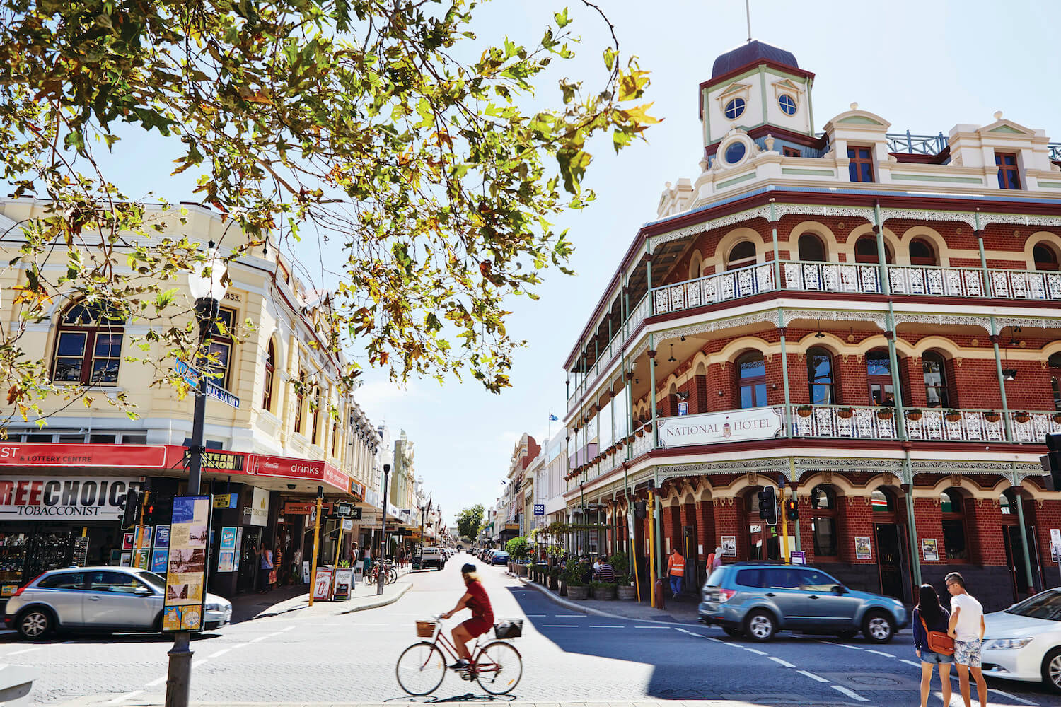 A crossroads with an old hotel and shops