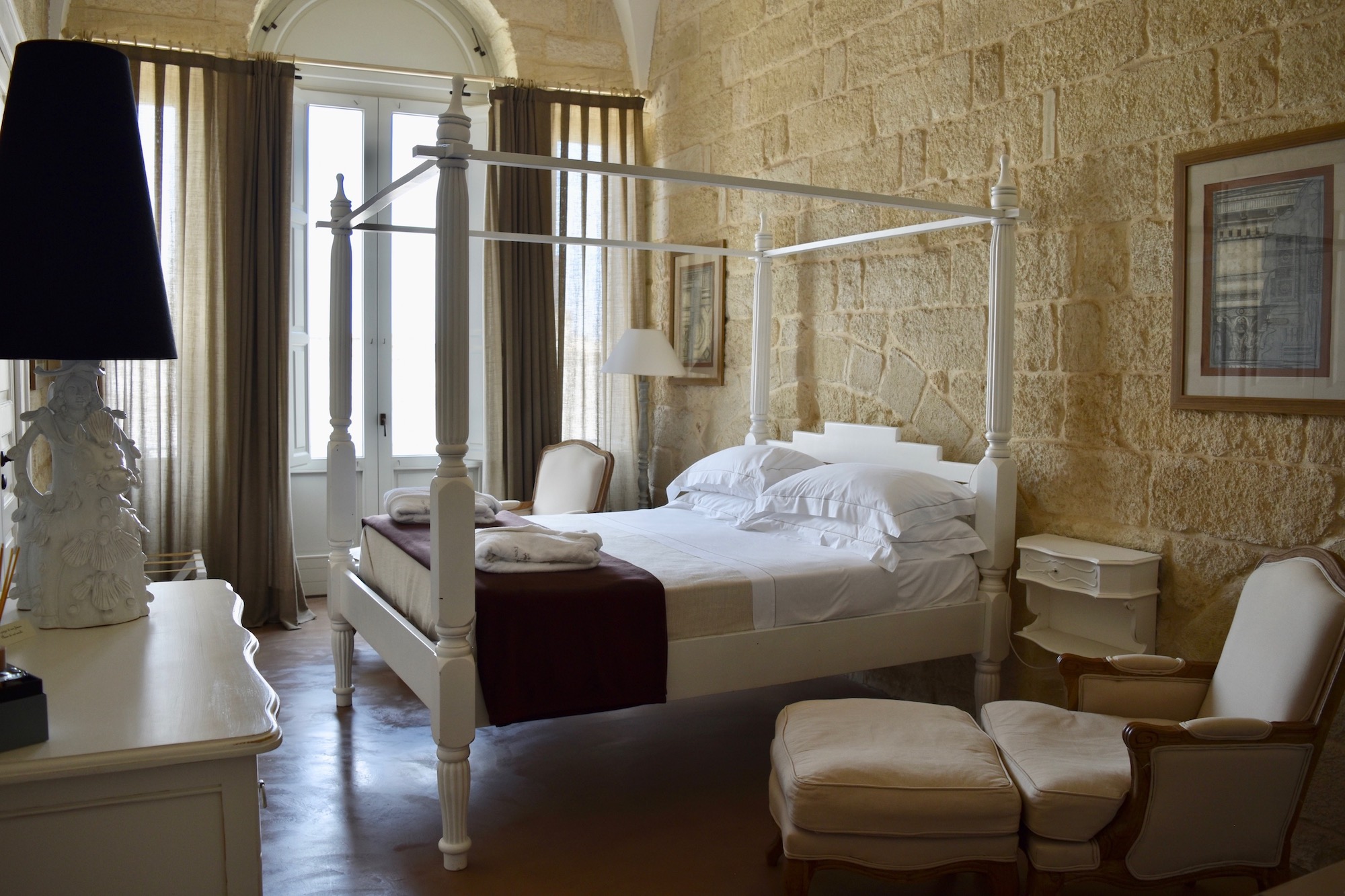 A grand four poster bed at Don Totu in Puglia