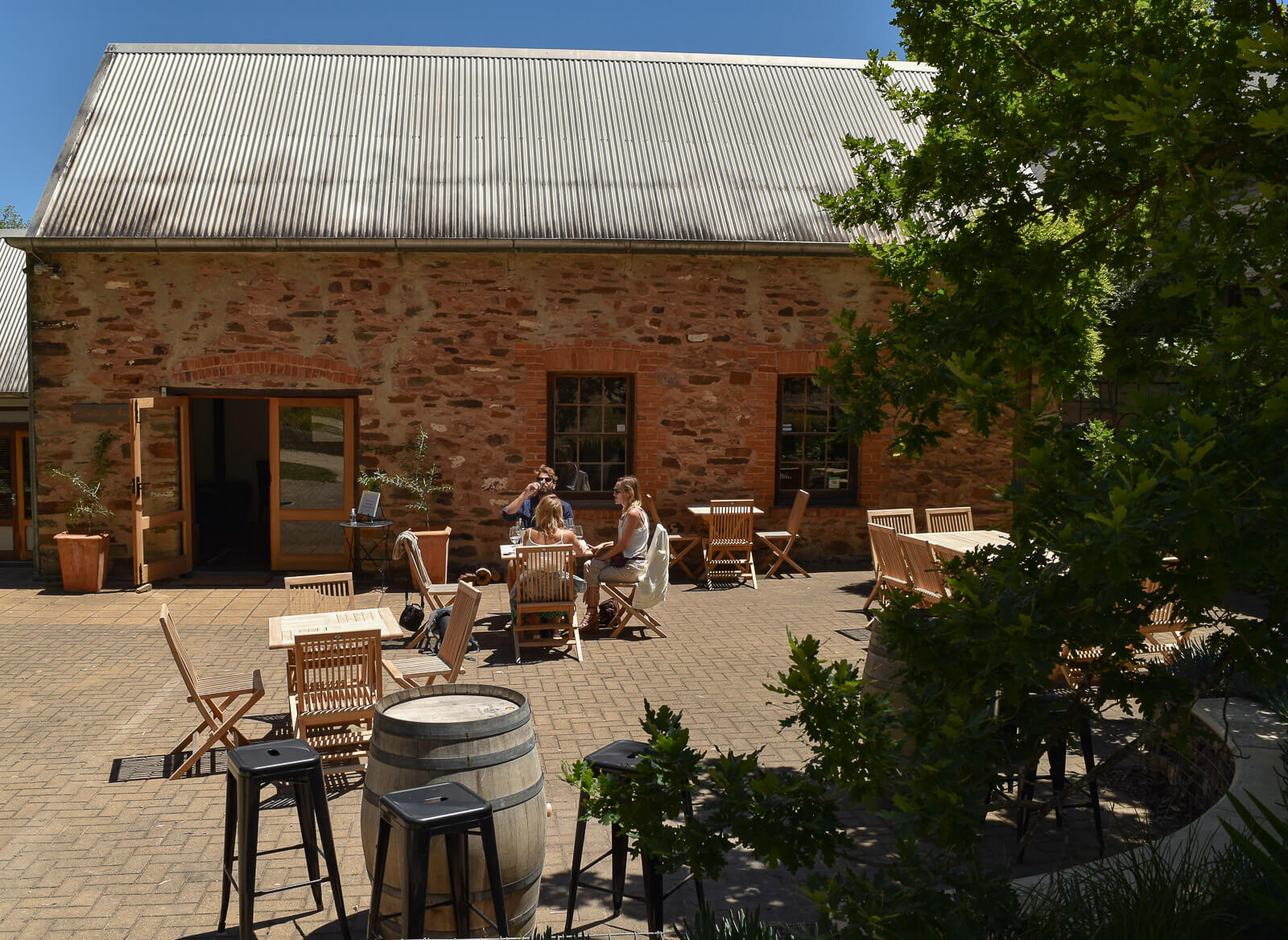 Friends sitting on a table outside Mitchell Wines cellar door