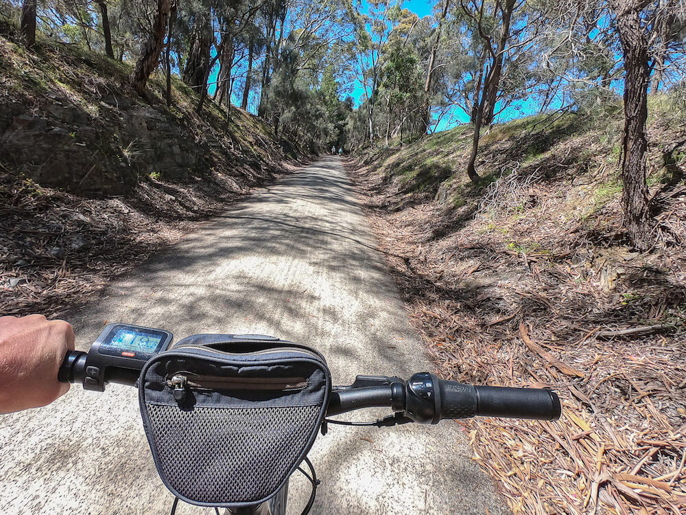 The handlebars of a bike looking down the Riesling Trail - a must do activity in a Clare Valley itinerary. 