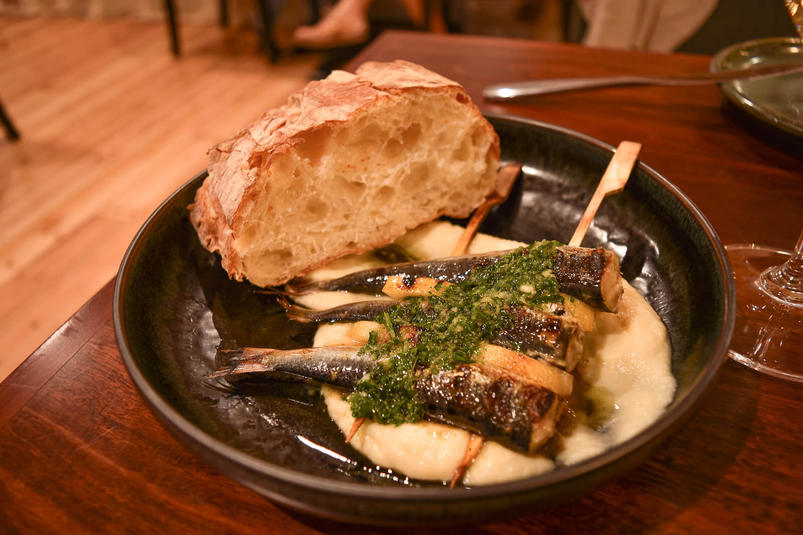 Sardines on a bed of mash with crusty bread