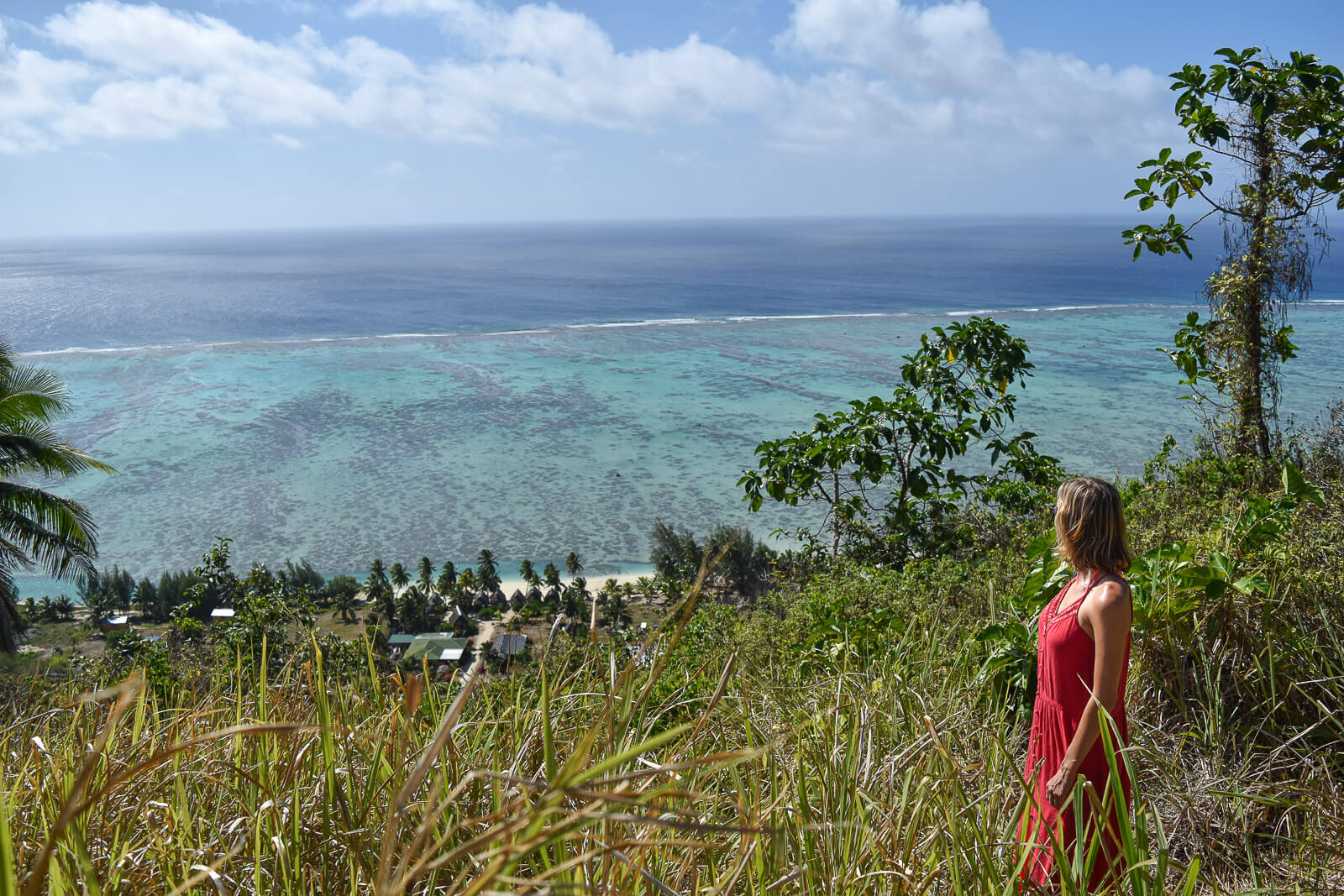 Hayley looking out over the lagoon on Aitutaki from the top of a hill