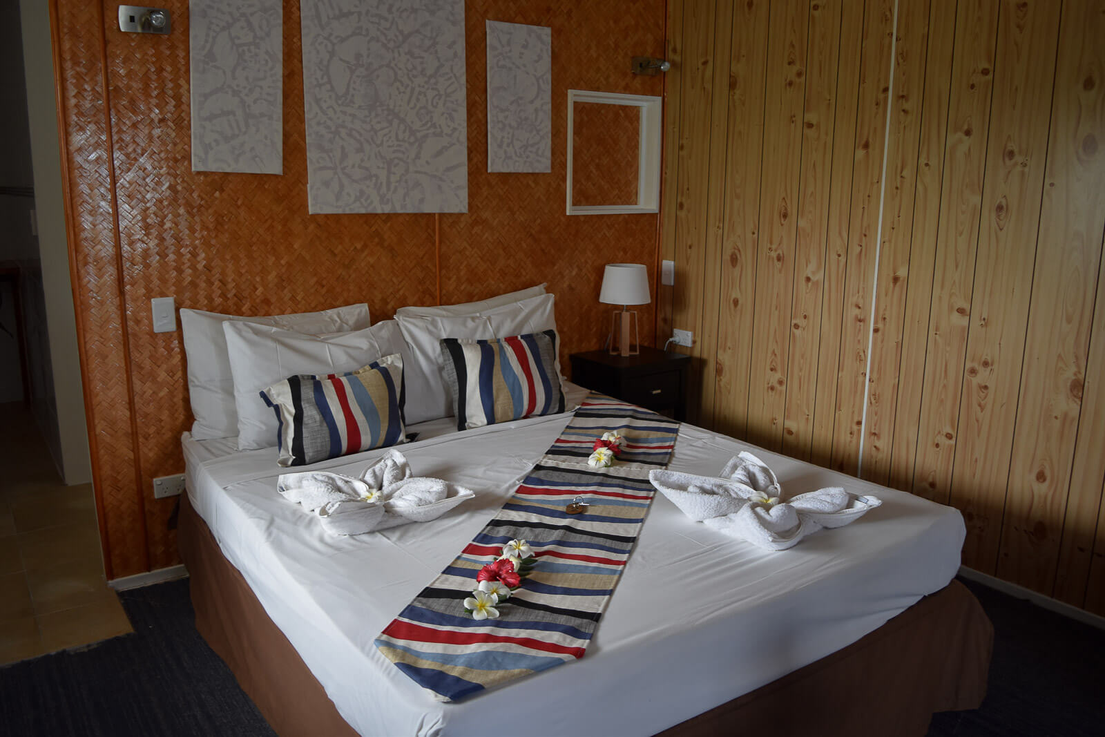 A bed with frangipani flowers decorating it