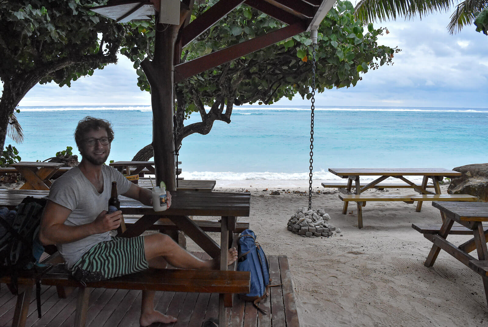 Enrico having a beer at a waterfront Rarotonga bar 