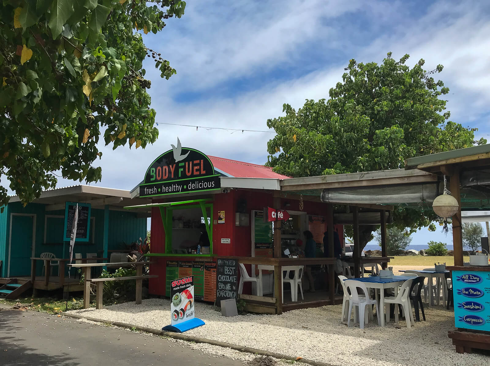 Market huts selling food by the water