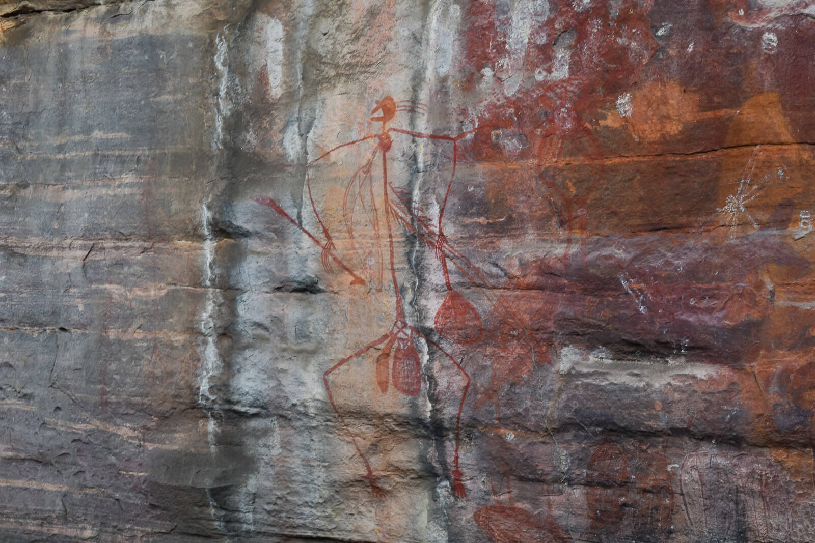 A rock paining of a man 