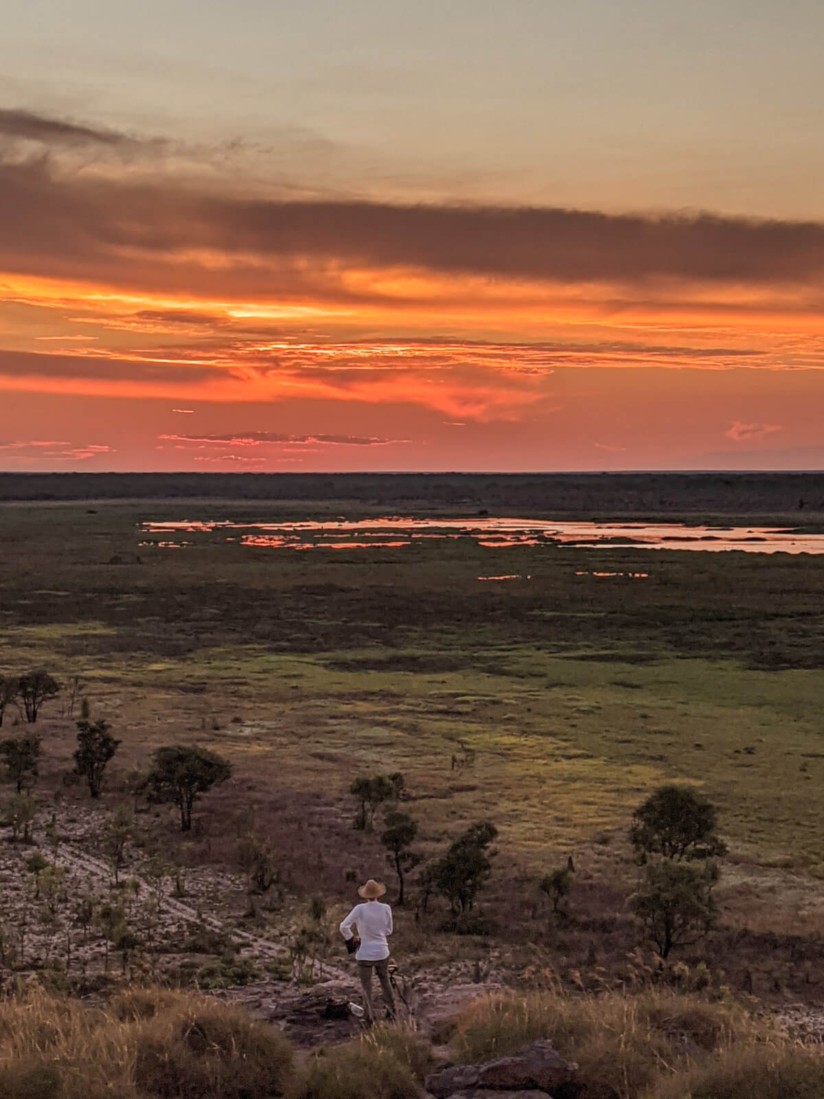 A orange sunset over flooded plains 