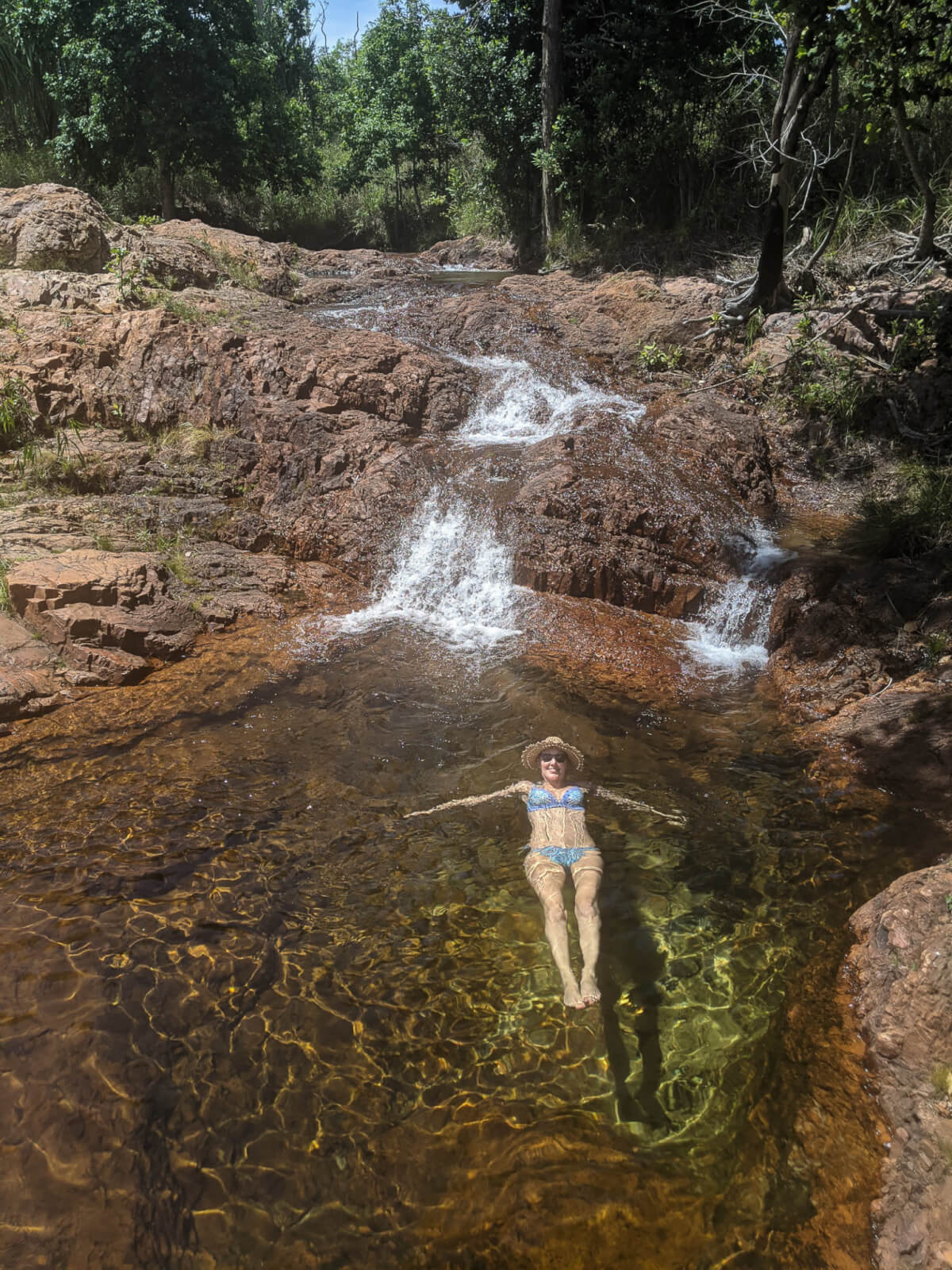 Hayley laying in a shallow rockpool