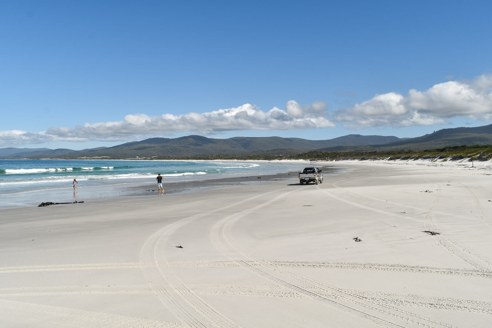 Wide sandy Denison Beach on the drive from Coles Bay to the Bay of Fires