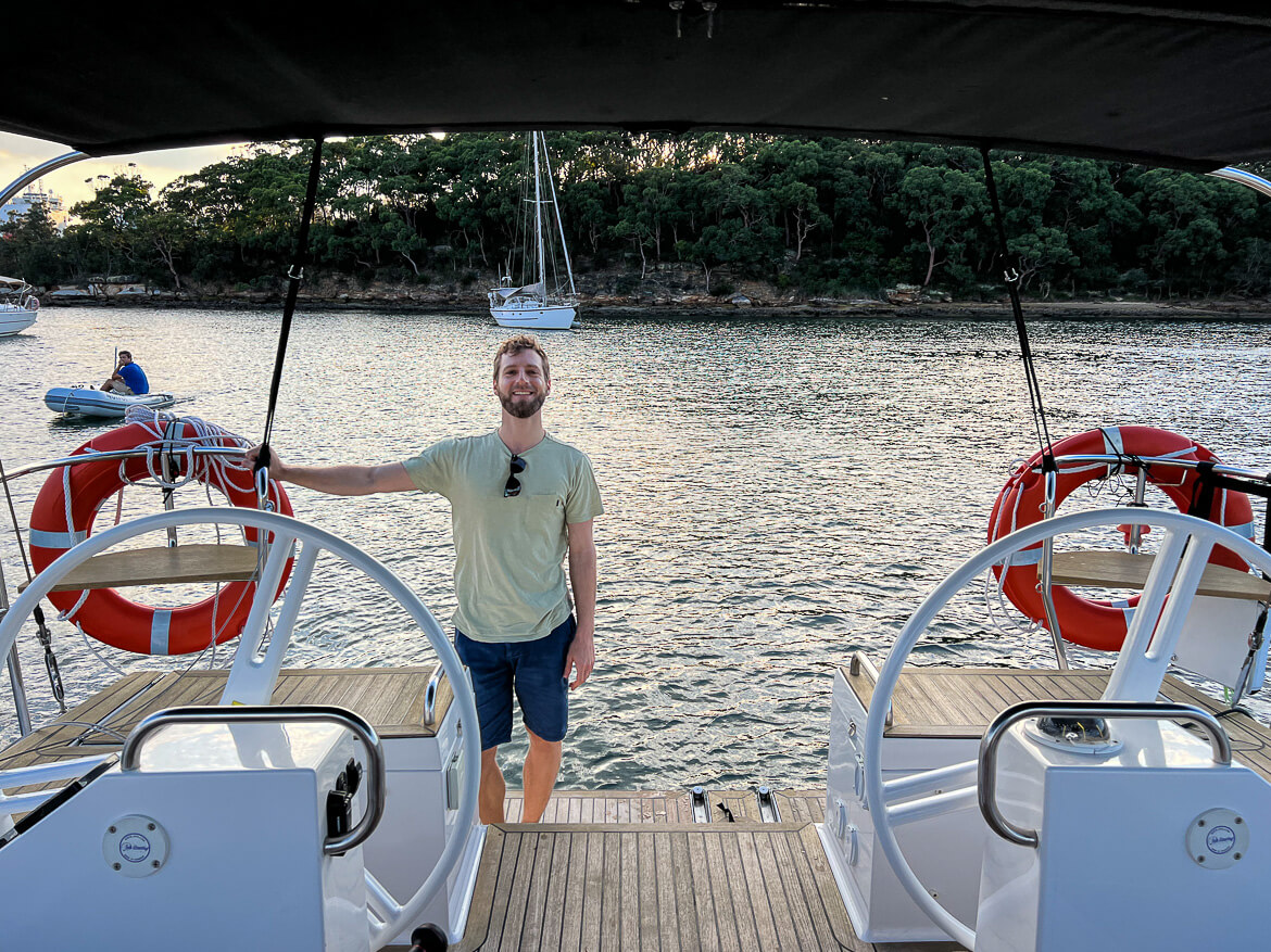Standing at the back of a moored yacht