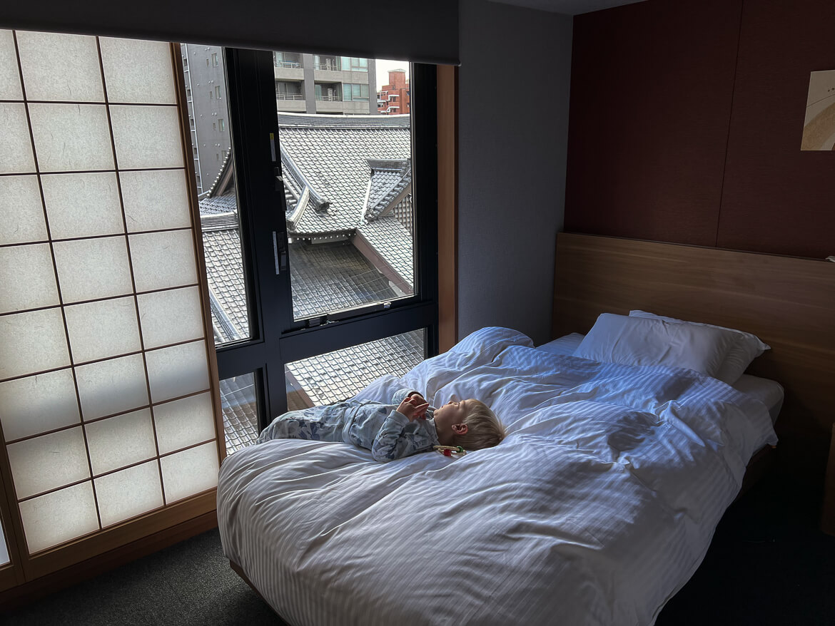 Our toddler enjoying the views from our apartment at Our three bedroom apartment at Mimaru Suites Kyoto Shijo