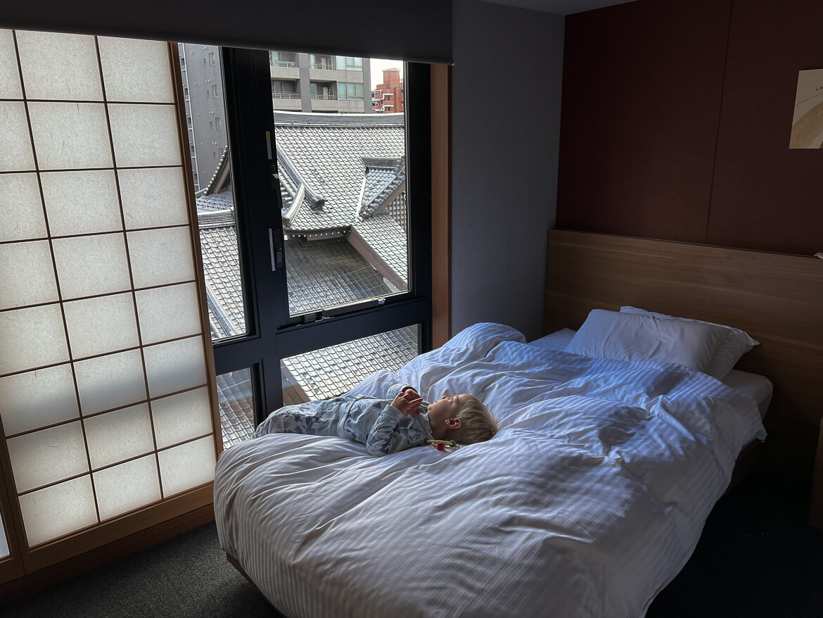 Our toddler enjoying the views from our apartment at Mimaru Suites Kyoto Shijo