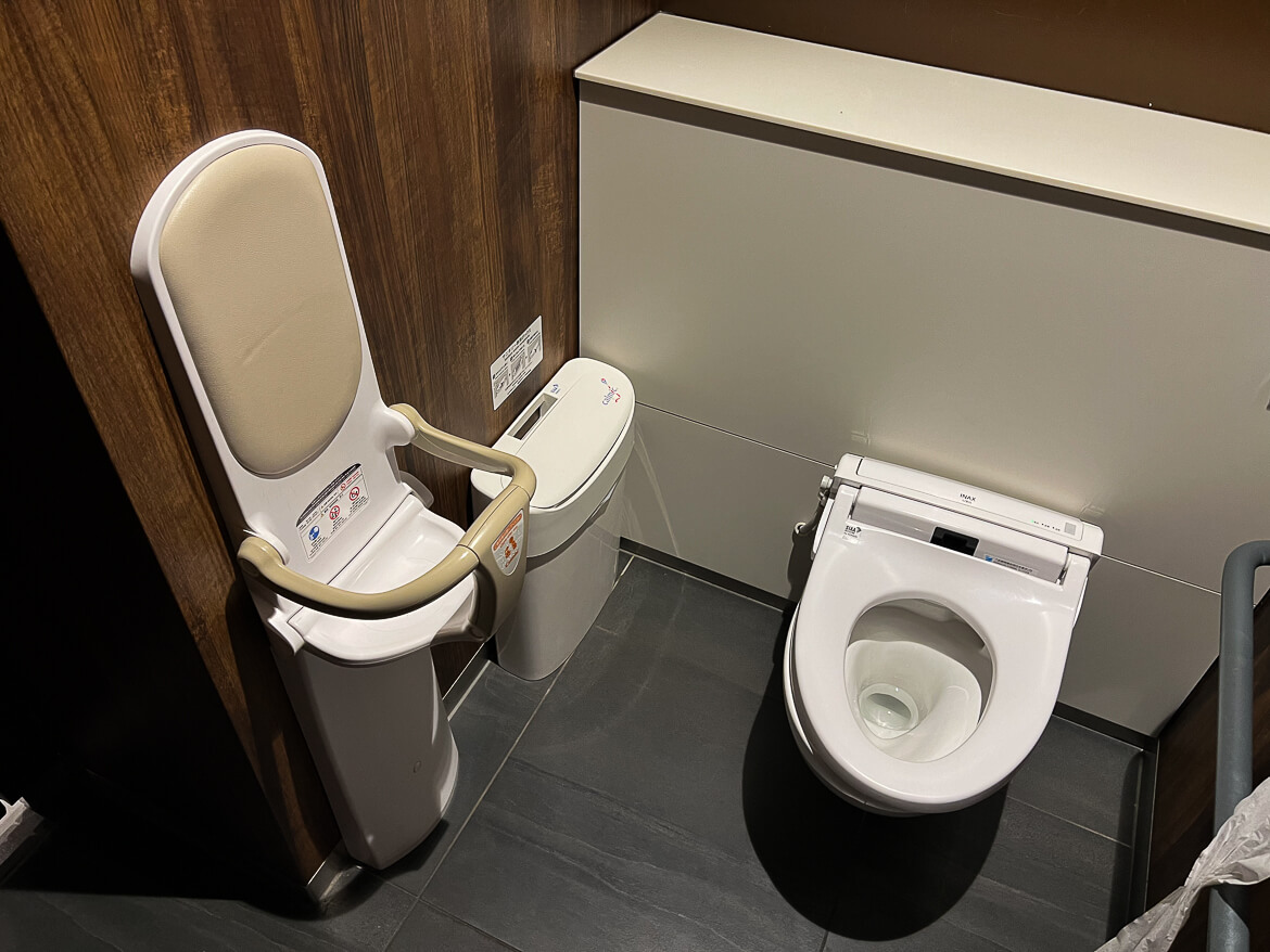 A baby seat in a Japanese bathroom