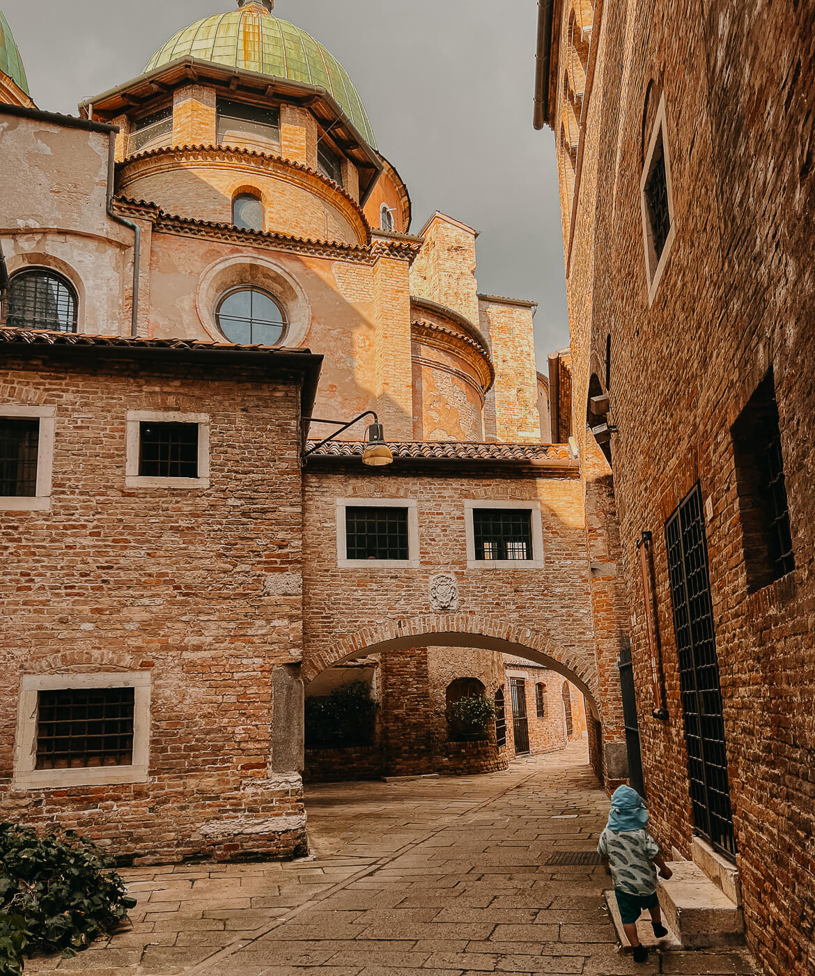 Our toddler running through the Italian city of Treviso