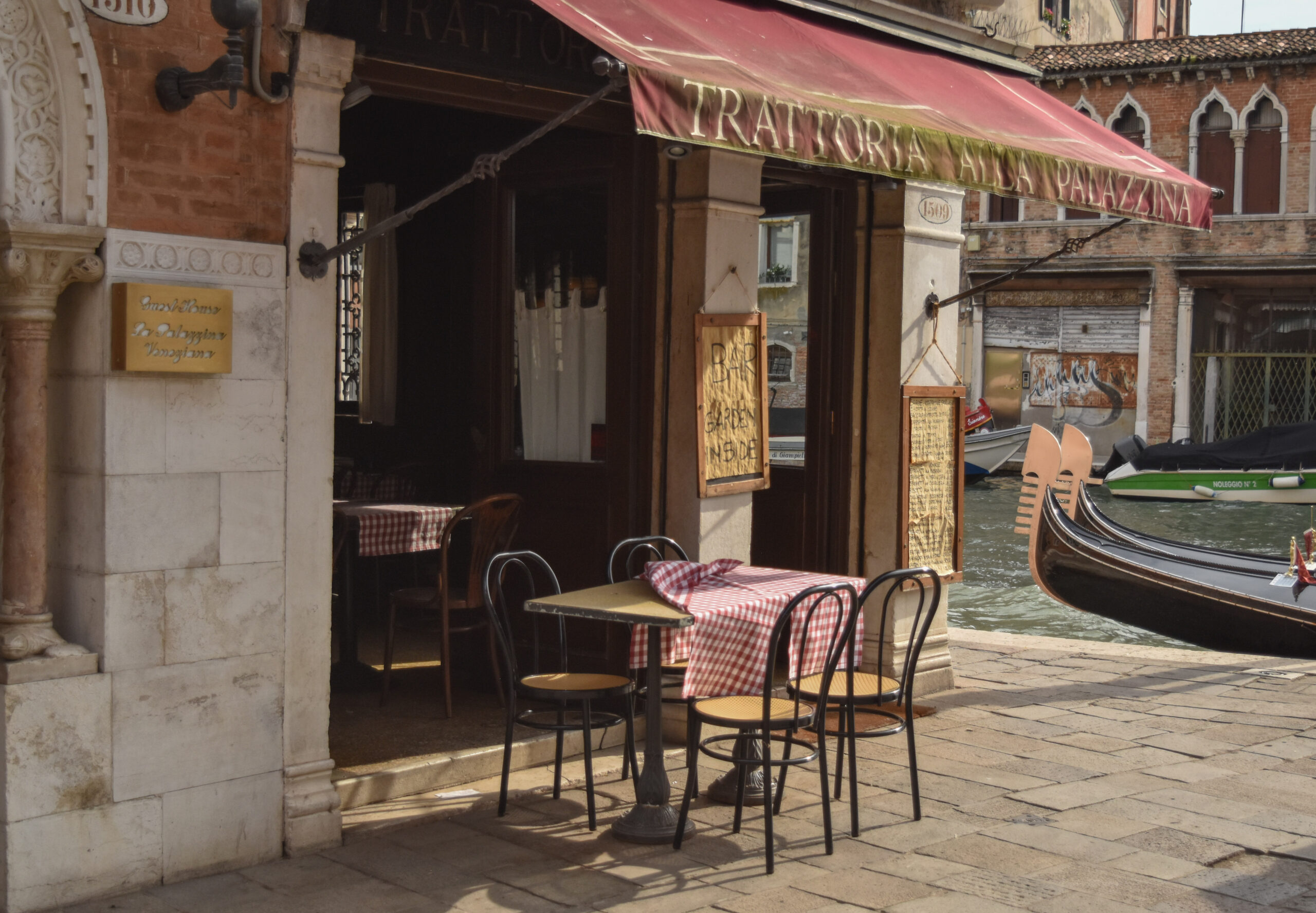 A restaurant overlooking a canal in Venice