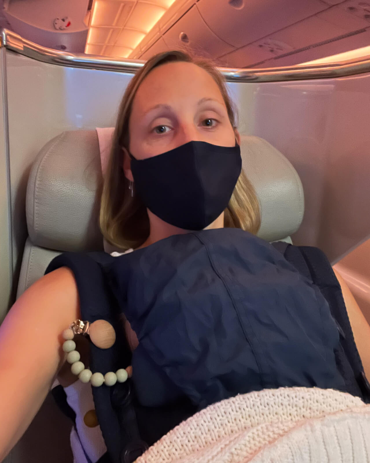 A sleeping baby on a long haul flight to Sydney