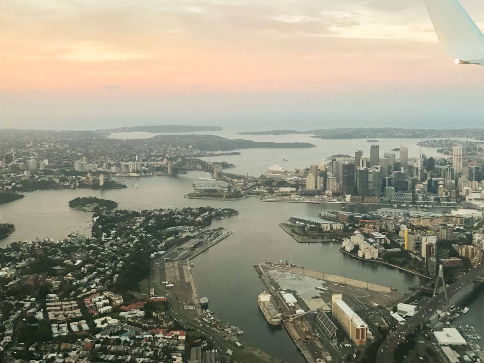 Flying over Sydney harbour on a long haul flight to London