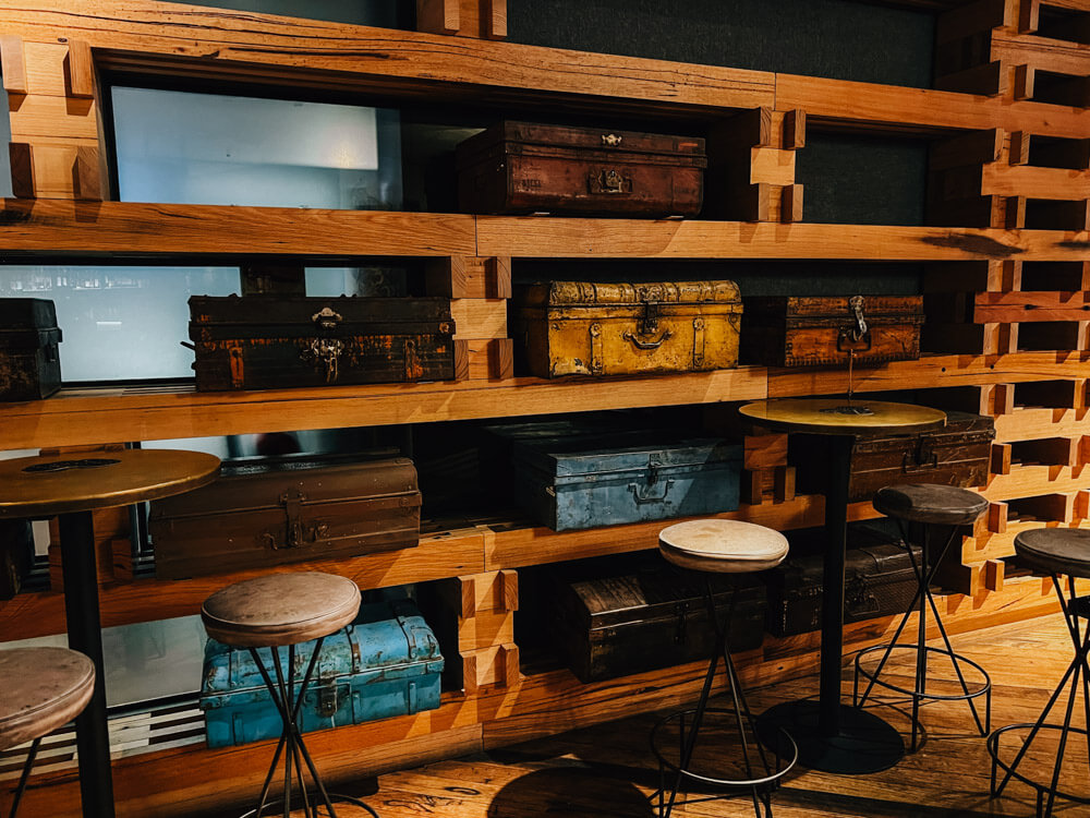 Antique suitcases line the walls at the Canberra hotel 
