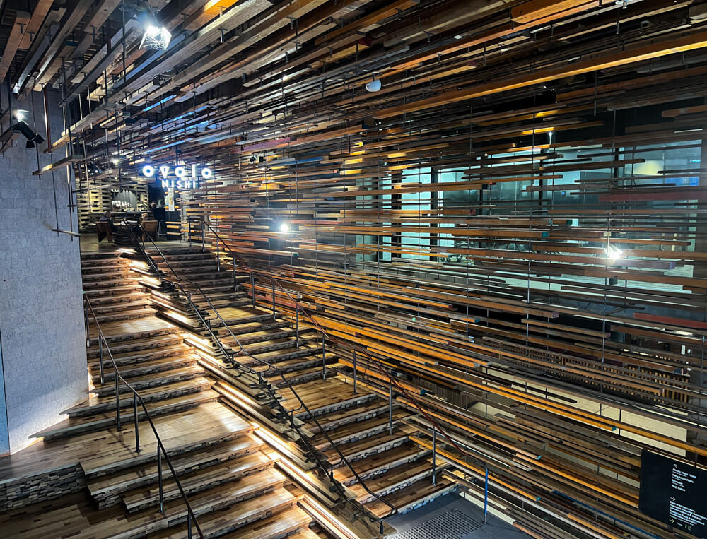 a large wooden staircase made of reclaimed wood