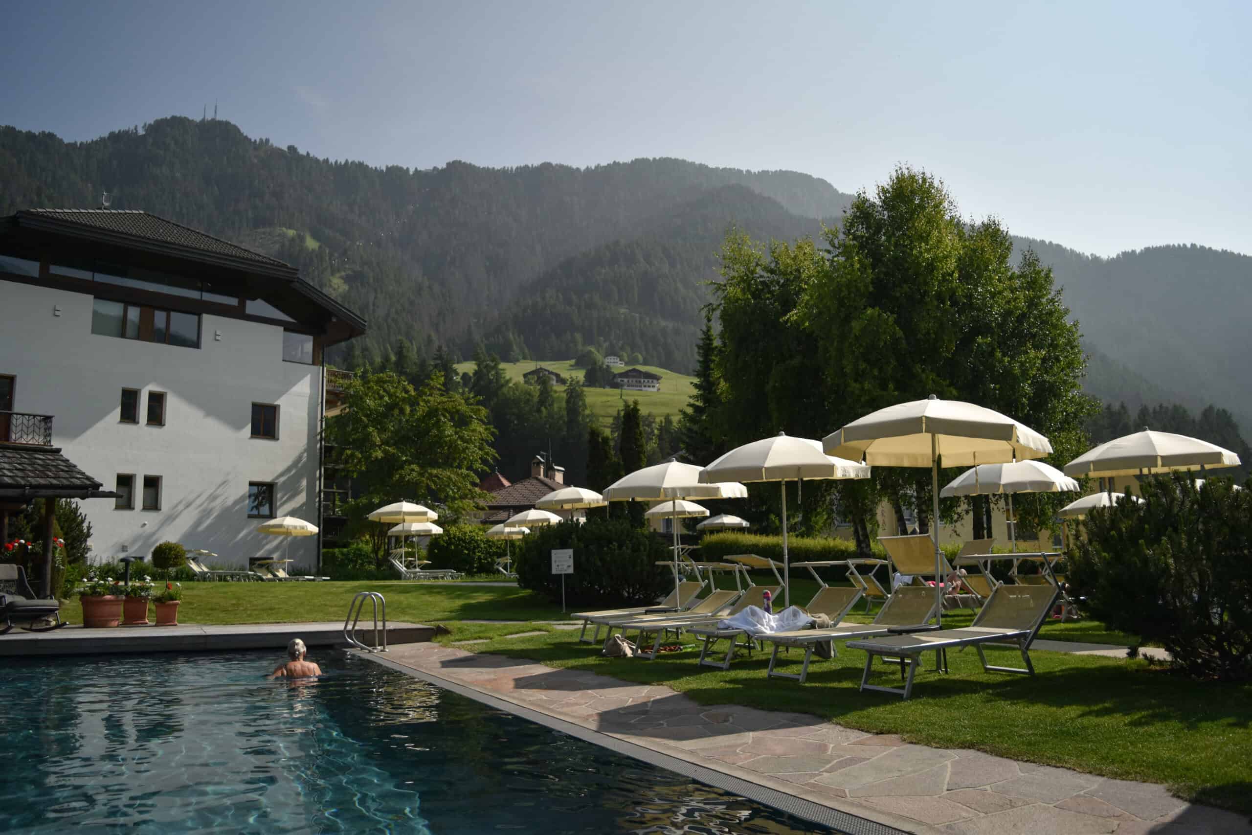 A pool swimming pool with a mountain backdrop