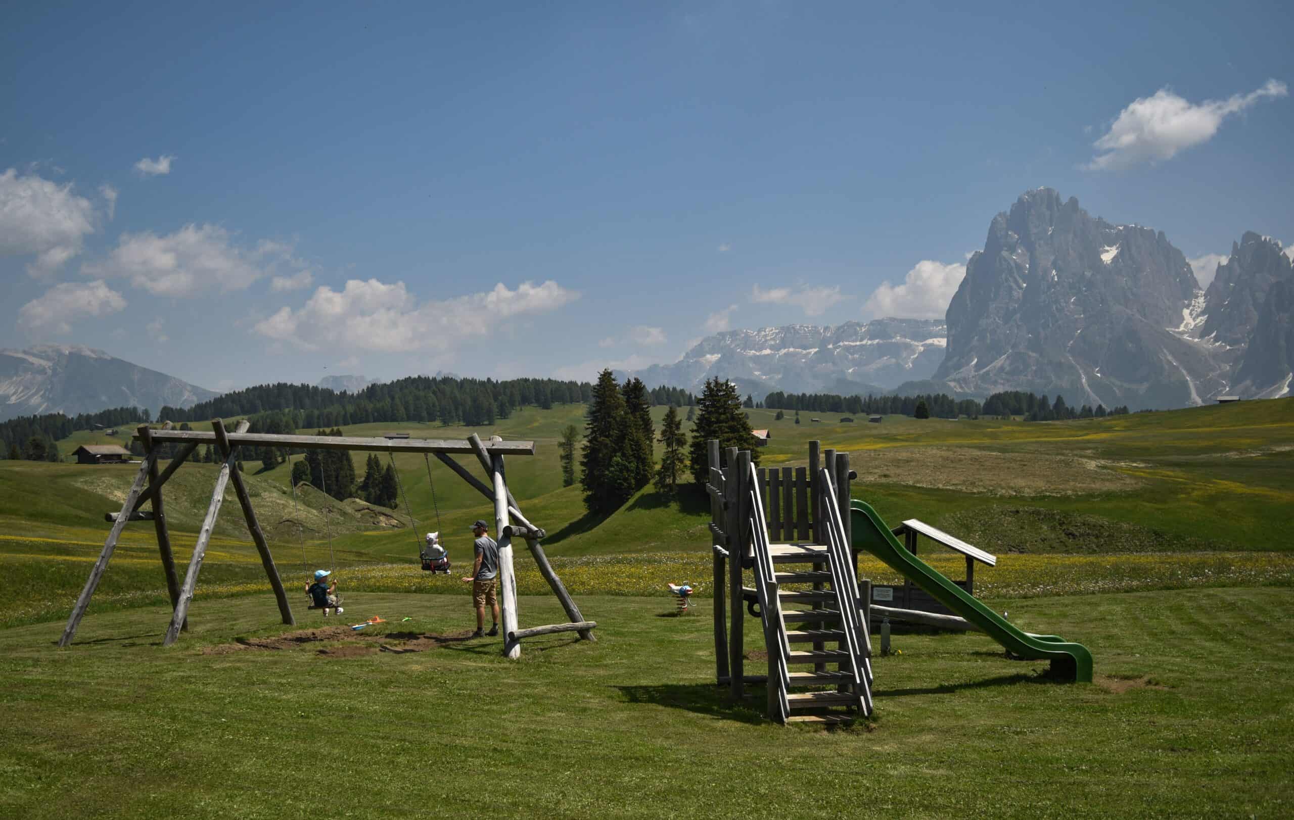 A family enjoying a park in the Dolomites